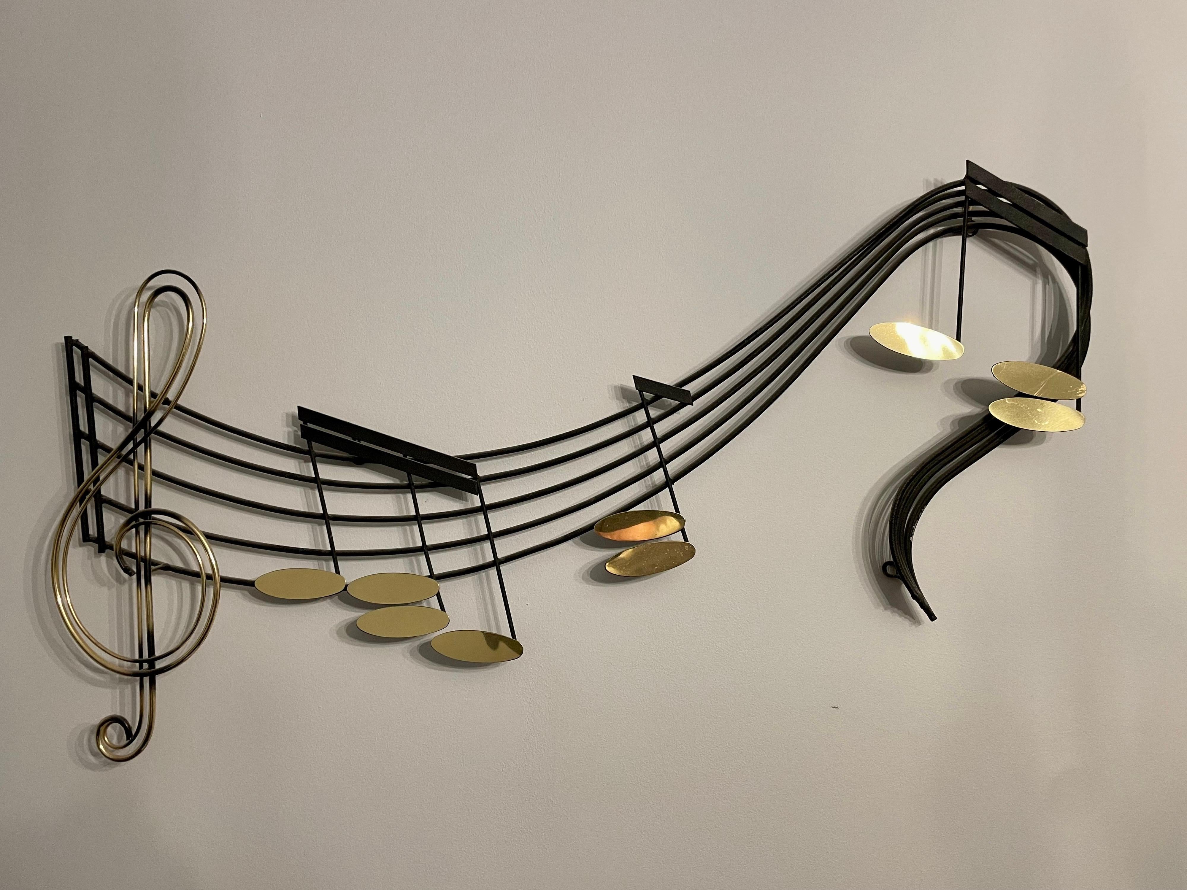 Curtis Jere music notes wall sculpture. Very nice vintage condition. Hung above the fireplace in the living room of the HBO Show The Sopranos.