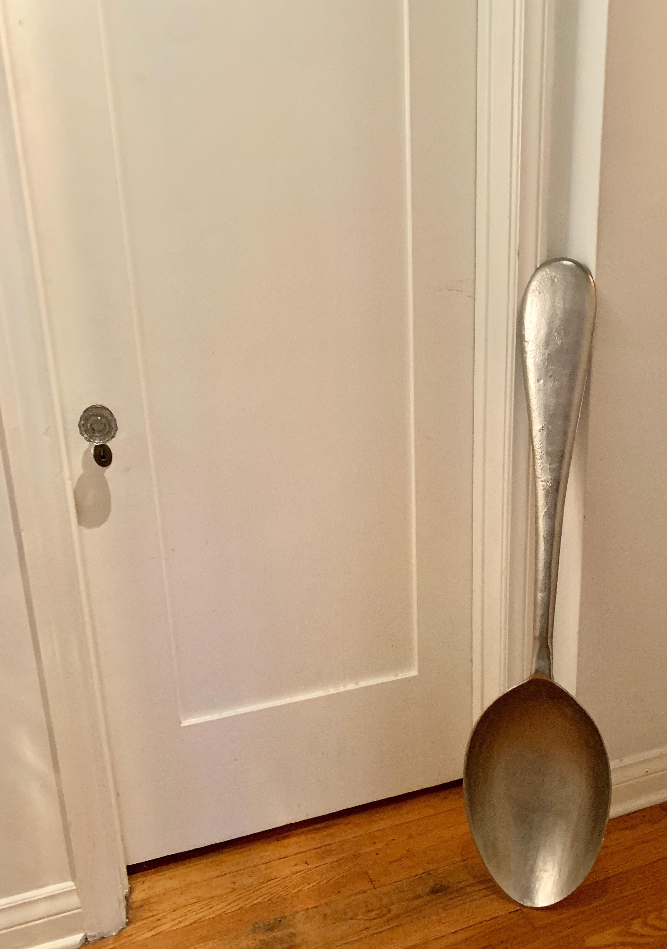 A fantastic replica of a spoon by Curtis Jere. The spoon is made of metal and looks identical to a household spoon, however it is huge at 46 Inhes tall... a wonderful addition to a coffee shop, the kitchen, bakery or just as a decorative item. Makes