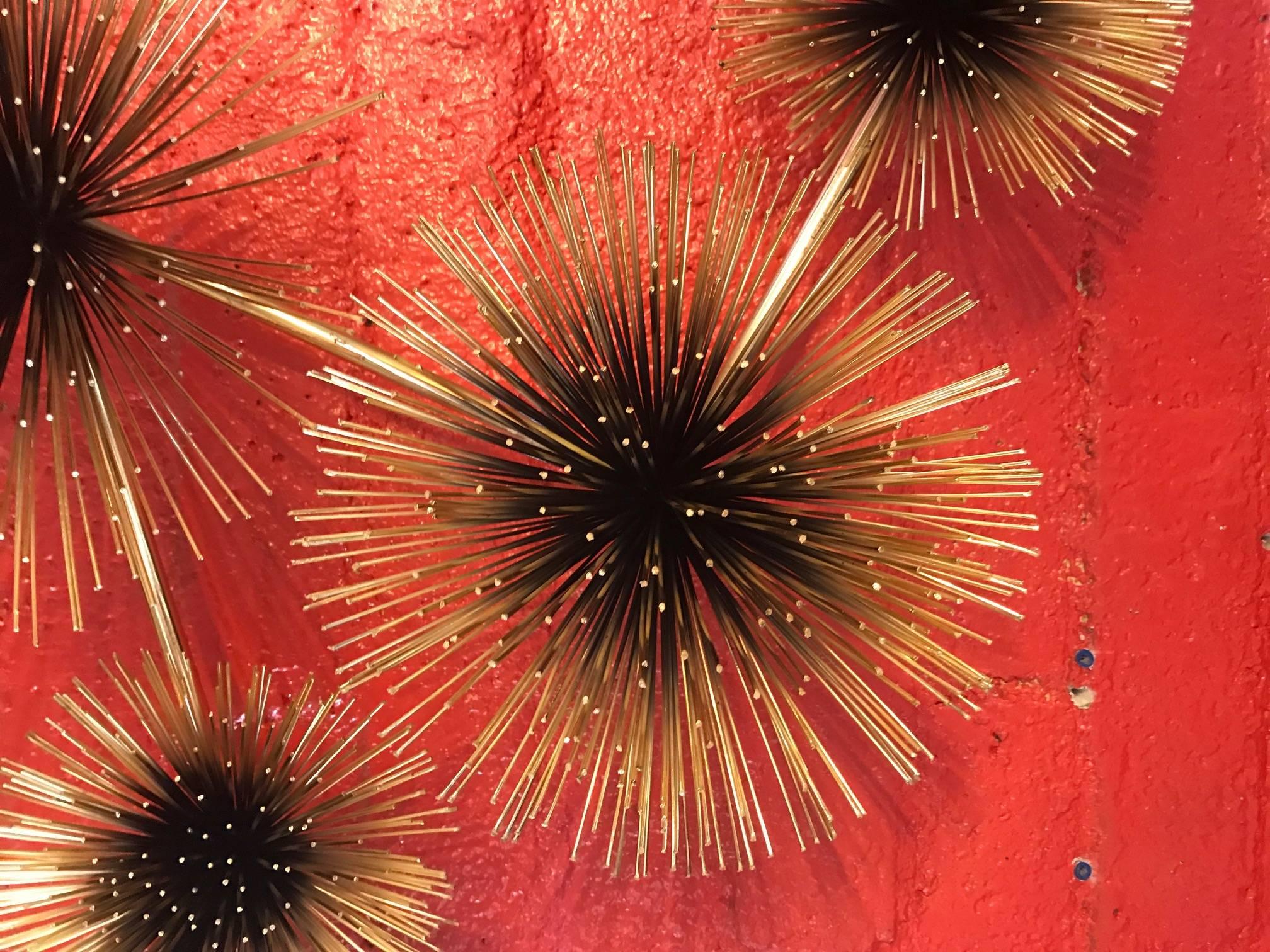 Elegant brass-plated and black painted five urchin or pom pom wall sculpture signed Curtis Jere
Note: Sculpture can hang in horizontal or vertical.