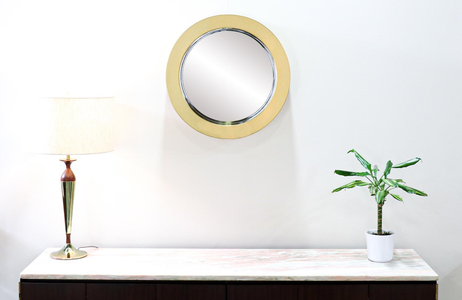 Curtis Jere round brass wall mirror for Artisan House.