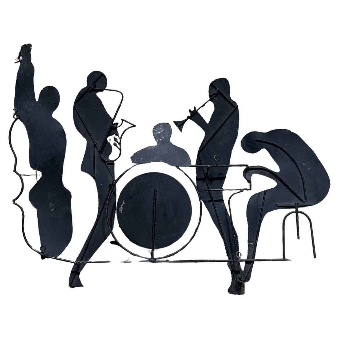 For your consideration,  a Curtis Jere Sculptures with Musicians - Jazz Scene. Singed in the lower section. USA circa the 1970s. Iron painted in black. It has hooks on the back so it can hung into the wall. 

We have another sculpture, similar must
