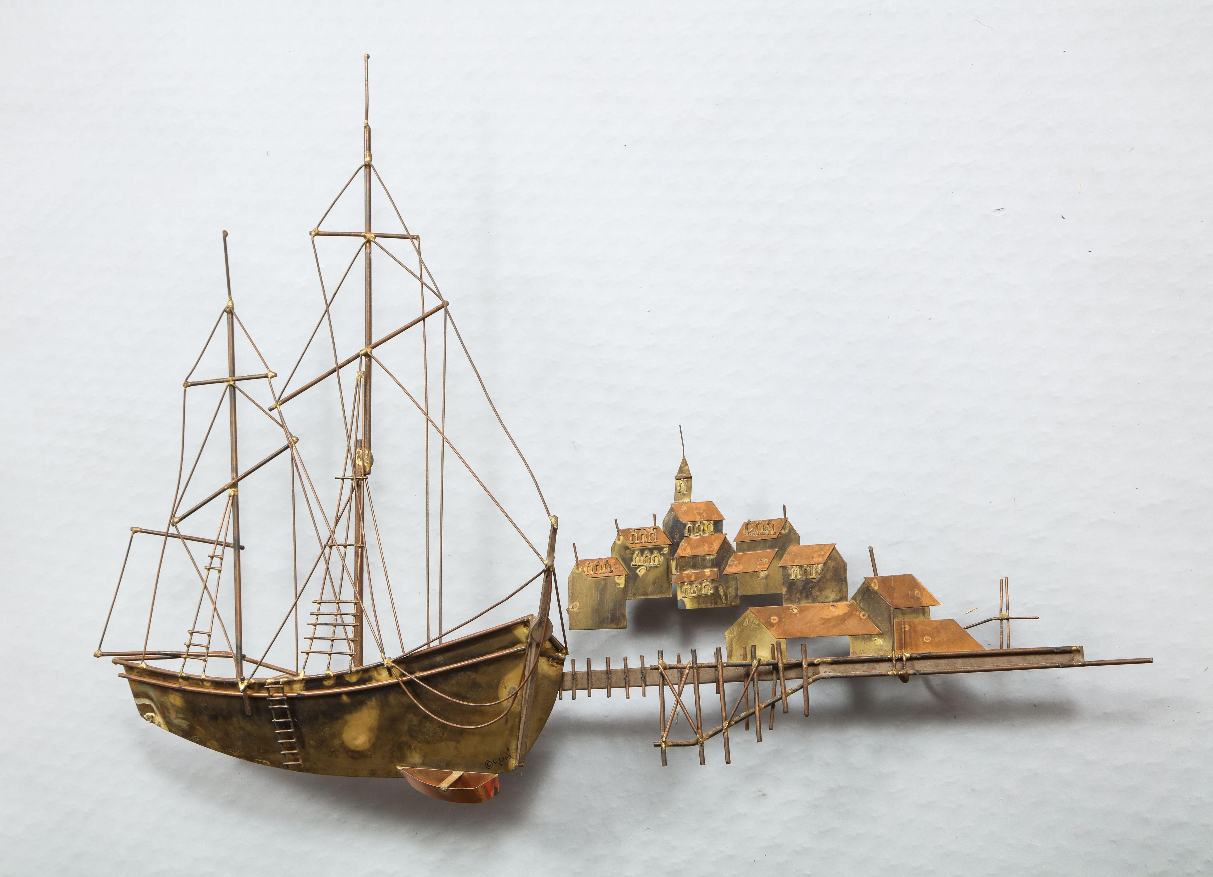 Fine mixed metal wall sculpture by Curtis Jeré depicting a two masted sailing vessel in a harbor with port town behind, very finely detailed and conceived, circa 1970.