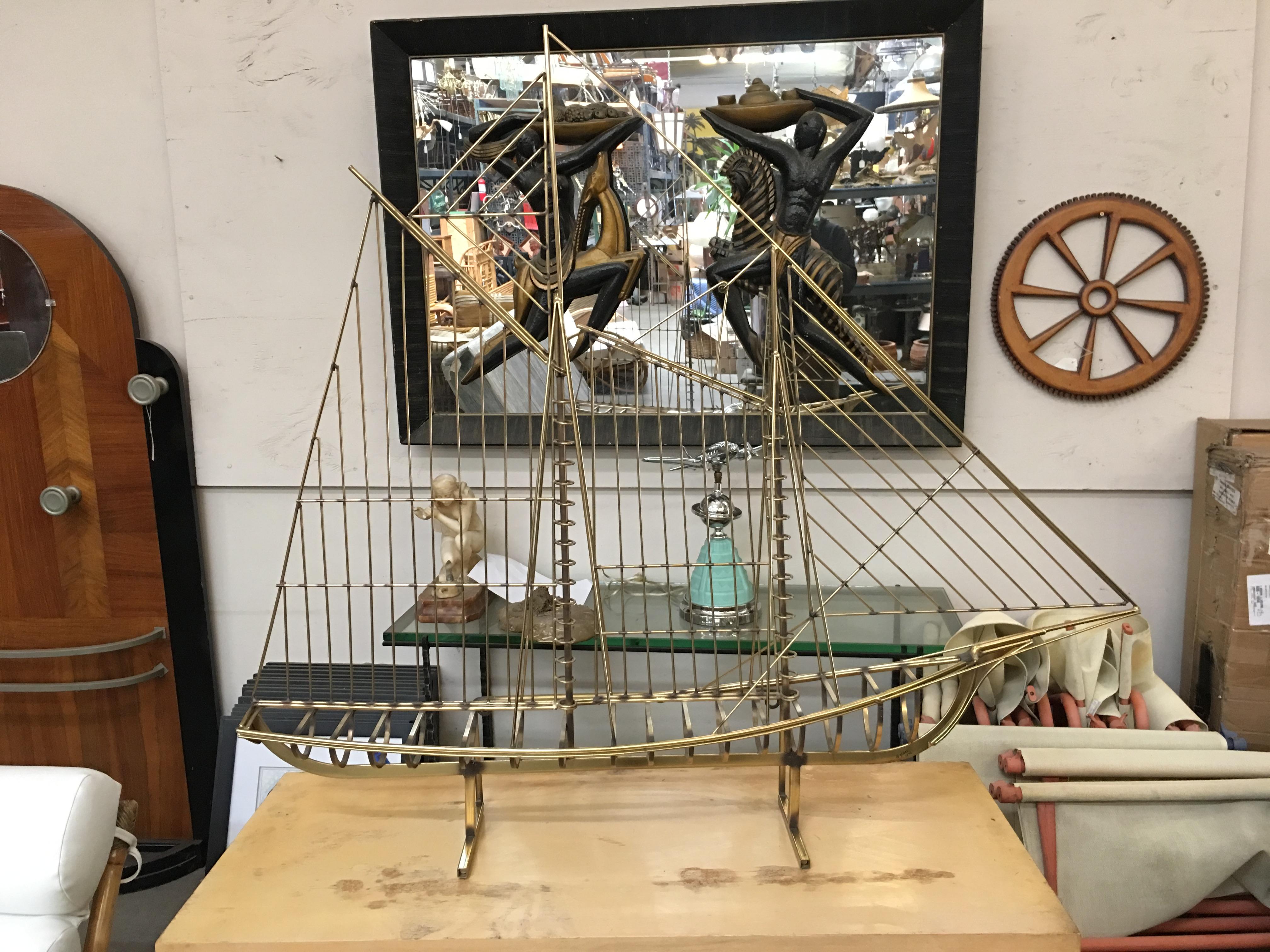 This Classic skeleton sailboat sculpture by Curtis Jere for Artisan House is skillfully rendered in brass and remains one of the company's most collectable designs. The sculpture may be displayed on a tabletop or mounted on the wall.