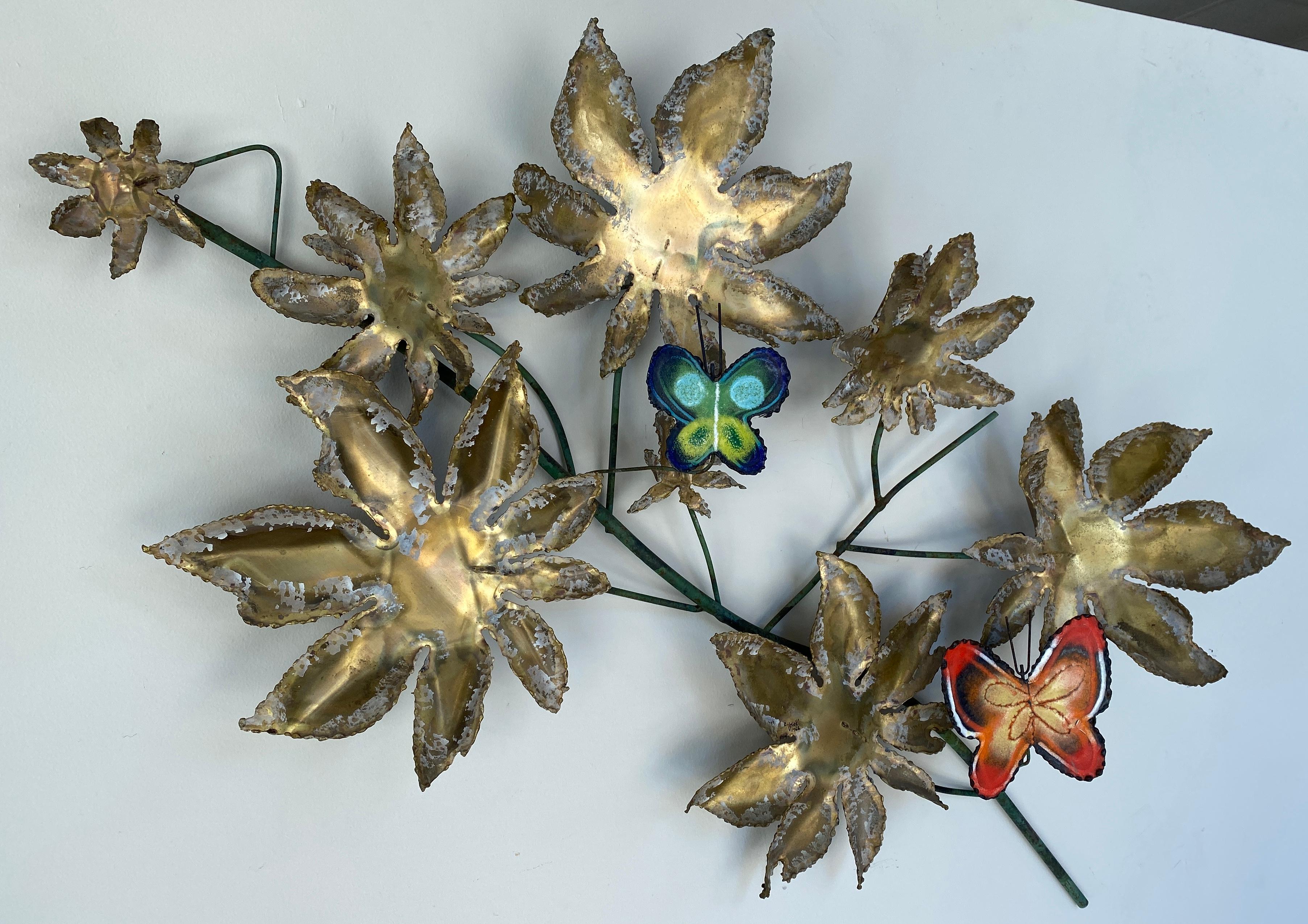 Offered here is a Curtis Jeré wall sculpture of butterflies on a tree branch for Artisan House.
Two butterflies, one mostly red enamel, with the other mostly blue enamel, with about 7 leaves of
different sizes surrounding them, branches holding