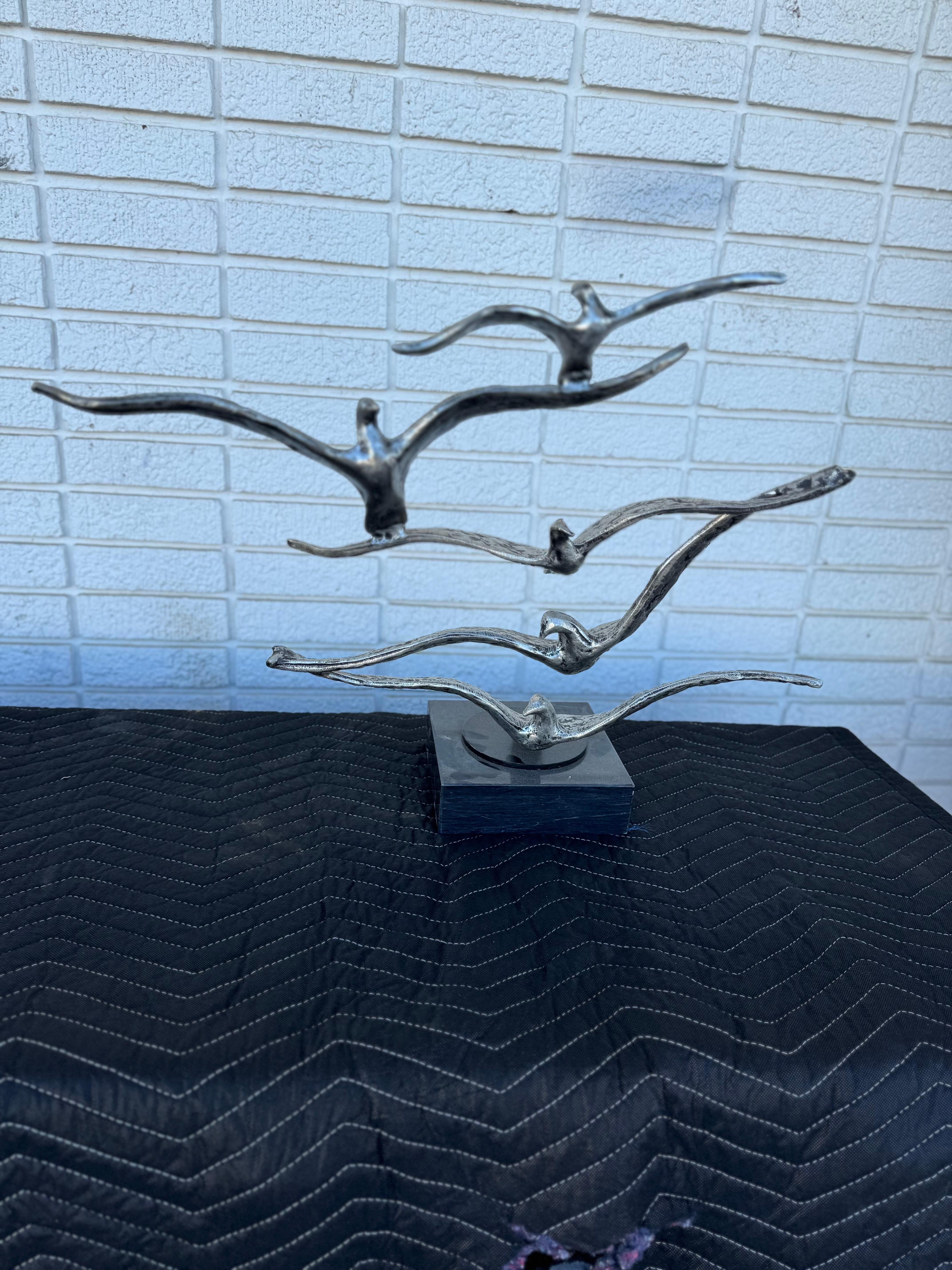 Elegant cast aluminum and granite sculpture from the 1980's. Brutalist style, decorative object, in excellent original condition. A classic and beautiful piece that can complement any home or office setting. 
Dimensions: 
Length: 14.5