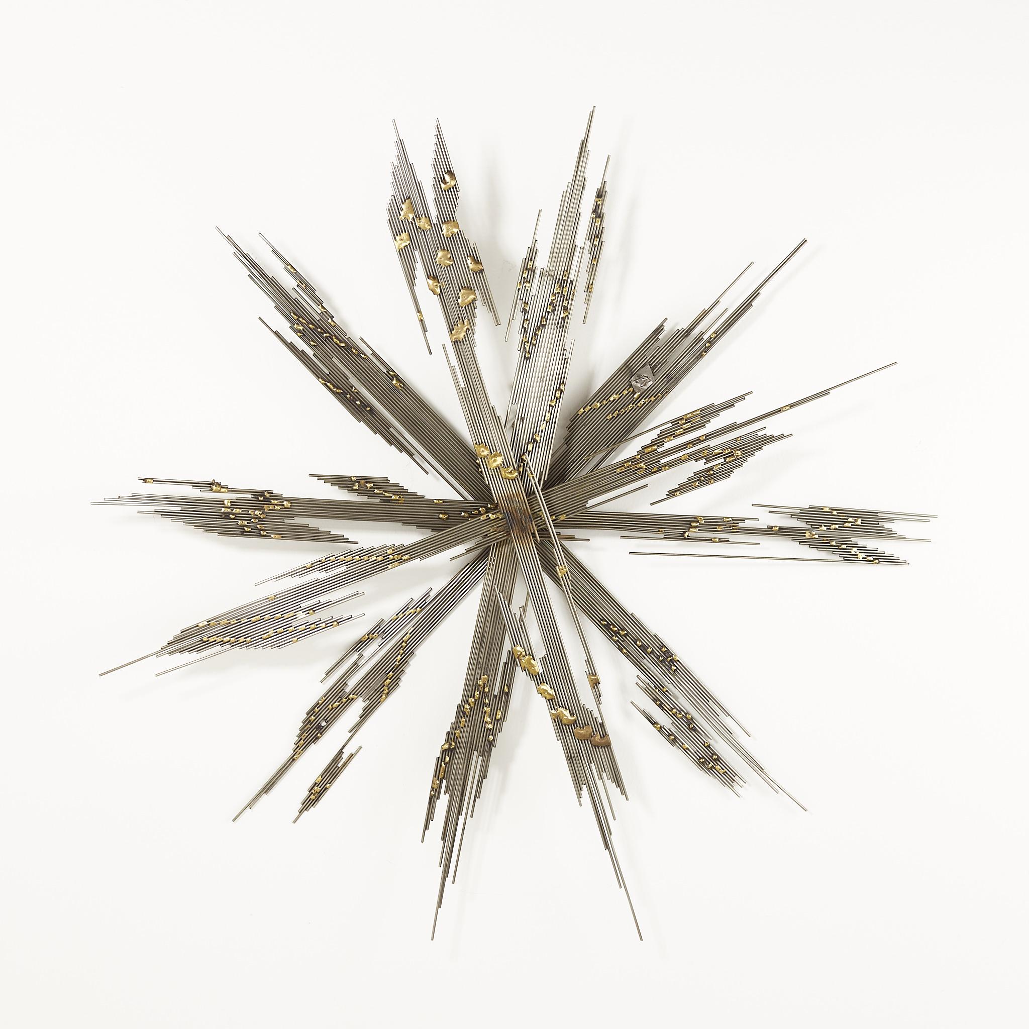 Curtis Jere style mid century steel and brass starburst wall art

This art piece measures: 36 wide x 3.5 deep x 36 inches high

This art piece is in excellent vintage condition.

We take our photos in a controlled lighting studio to show as