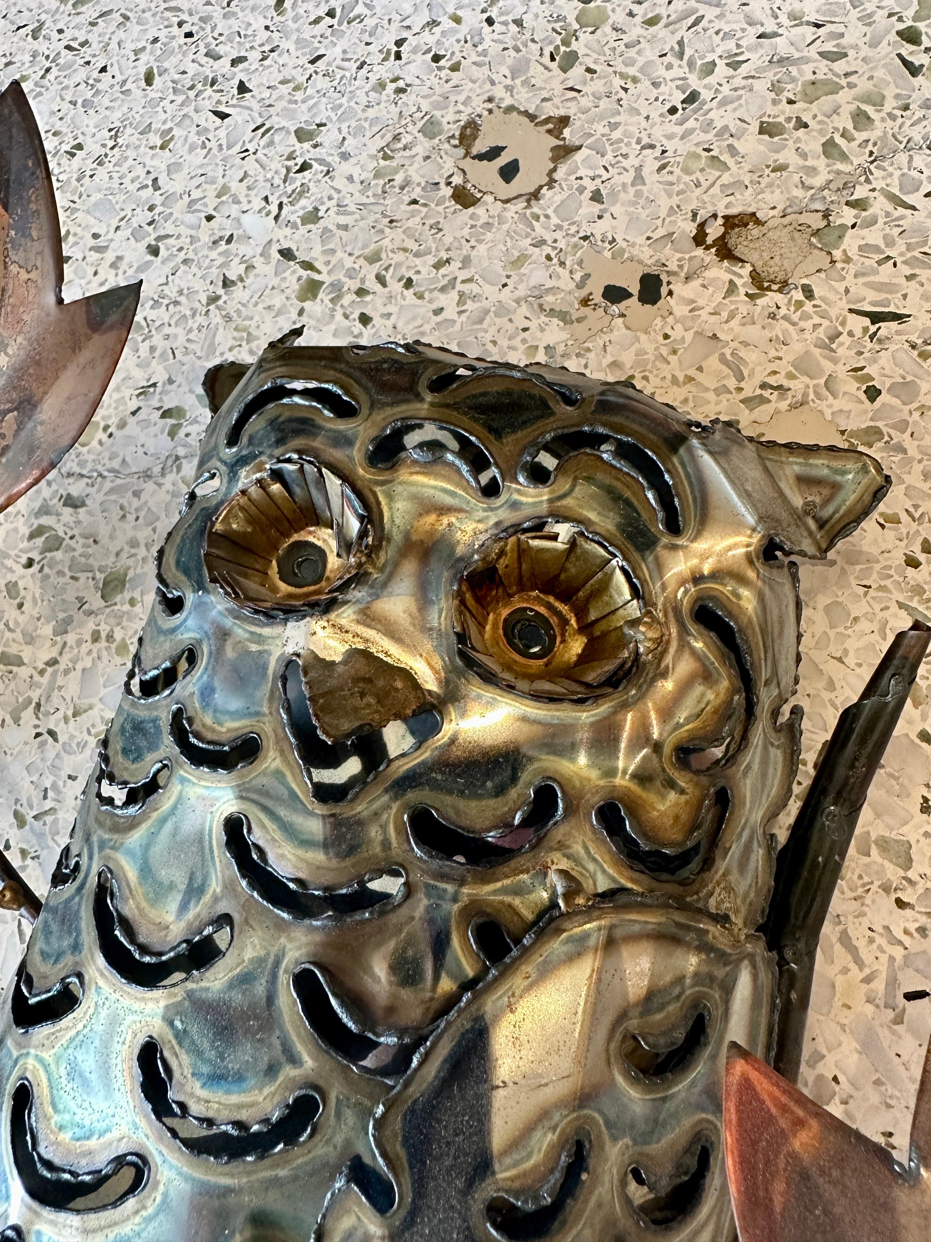 Made of multiple mixed metals (brass, steel and copper) - this whimsical owl on a branch wall sculpture.  THIS ITEM IS LOCATED AND WILL SHIP FROM OUR MIAMI, FLORIDA SHOWROOM.