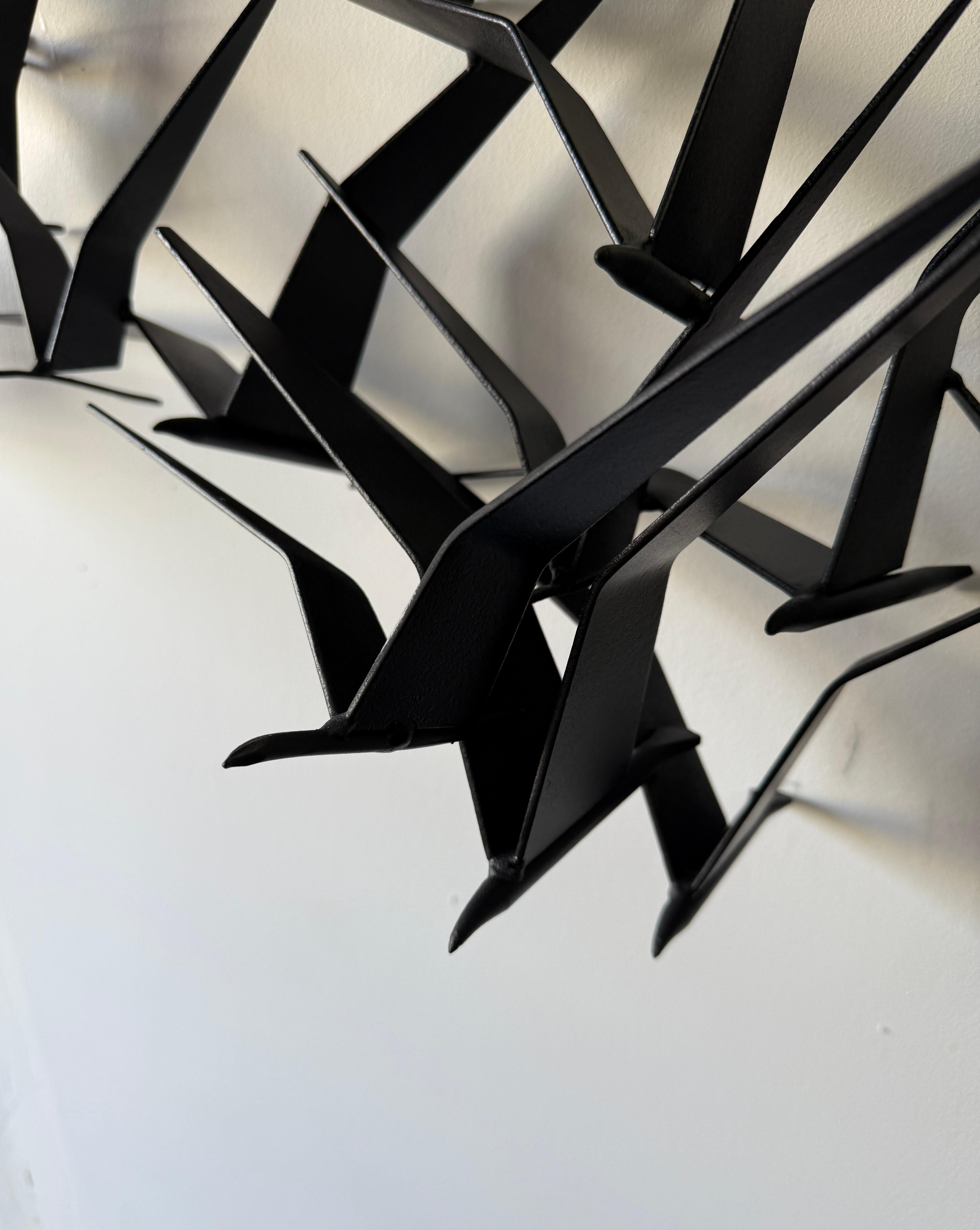 La scultura murale Birds in Flight di Curtis Jere 1
