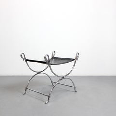Curule stool in chromed steel, adorned with swan heads and a black seat