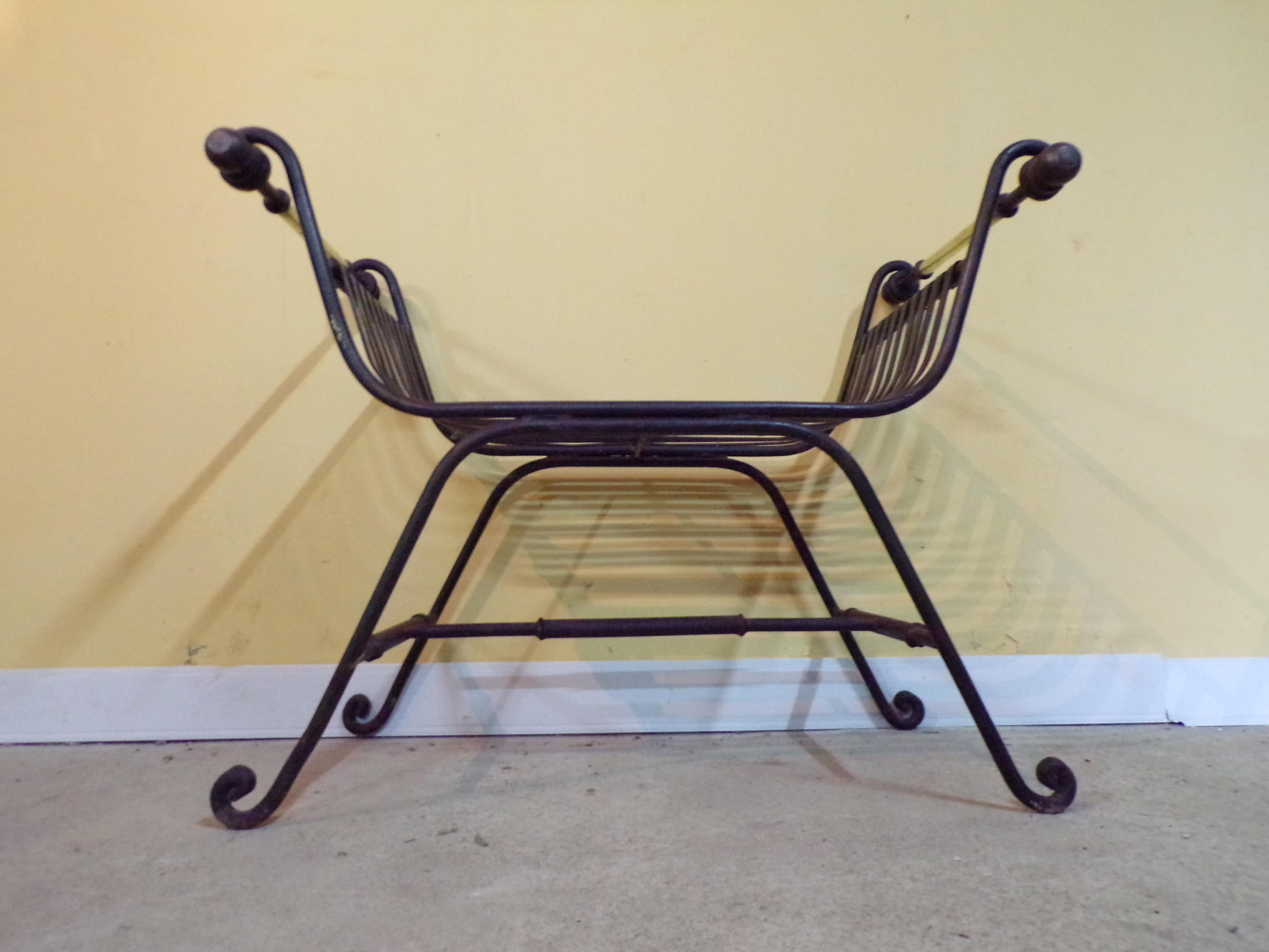 Beautiful vintage X frame or Curule chair of generous proportions in polished iron and brass, circa 1930s.
This is a very substantial and comfortable chair., and will grace any interior whether contemporary or traditional.
 