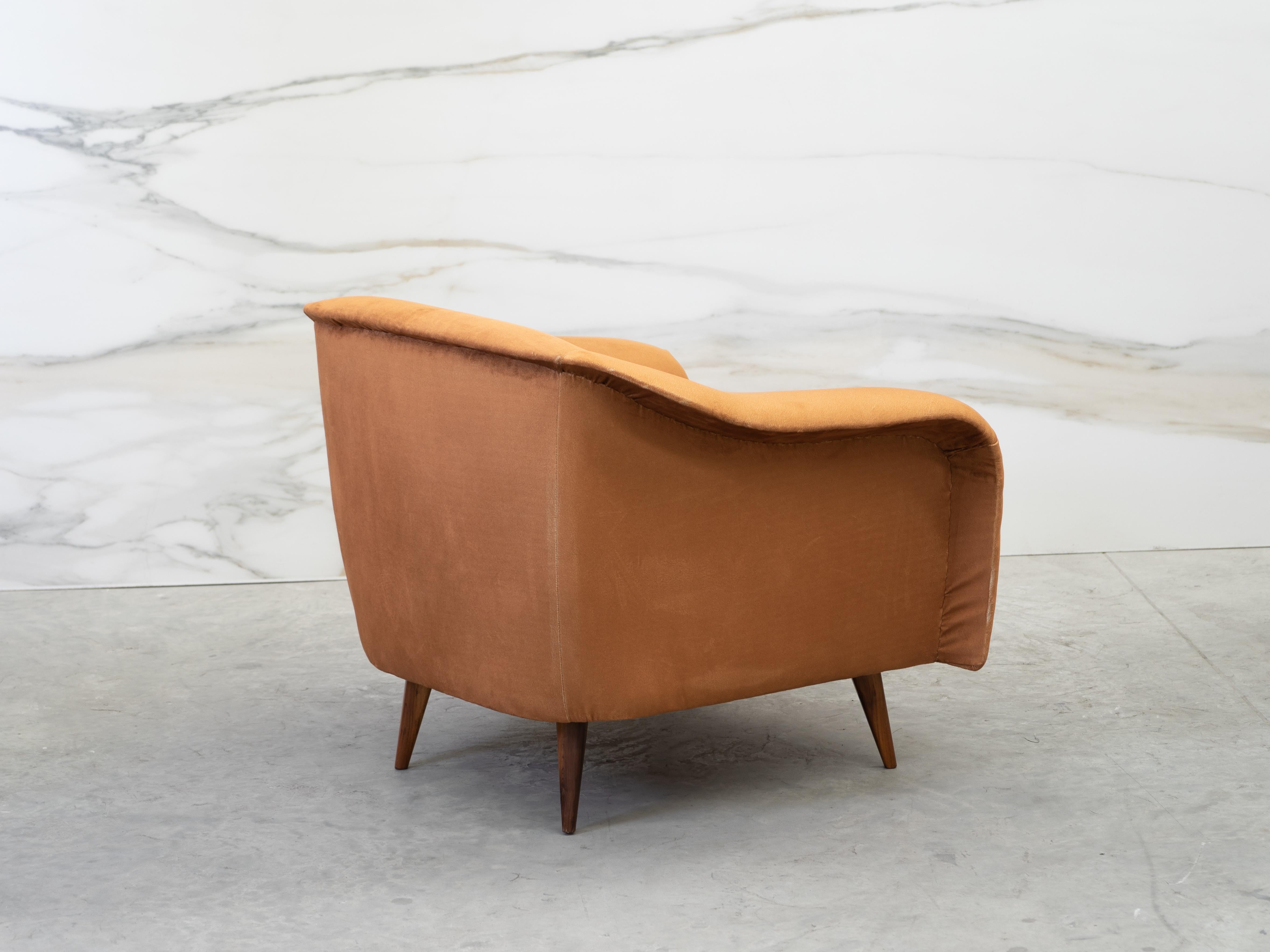 Armchair curved armchairs designed by Joaquim Tenreiro 

Shell-shaped seat wooden frame with fabric- upholstered padding and produced circa the 1960s, raised on tapered legs in Brazilian Rosewood. Very good vintage condition.
Recently upholstered
