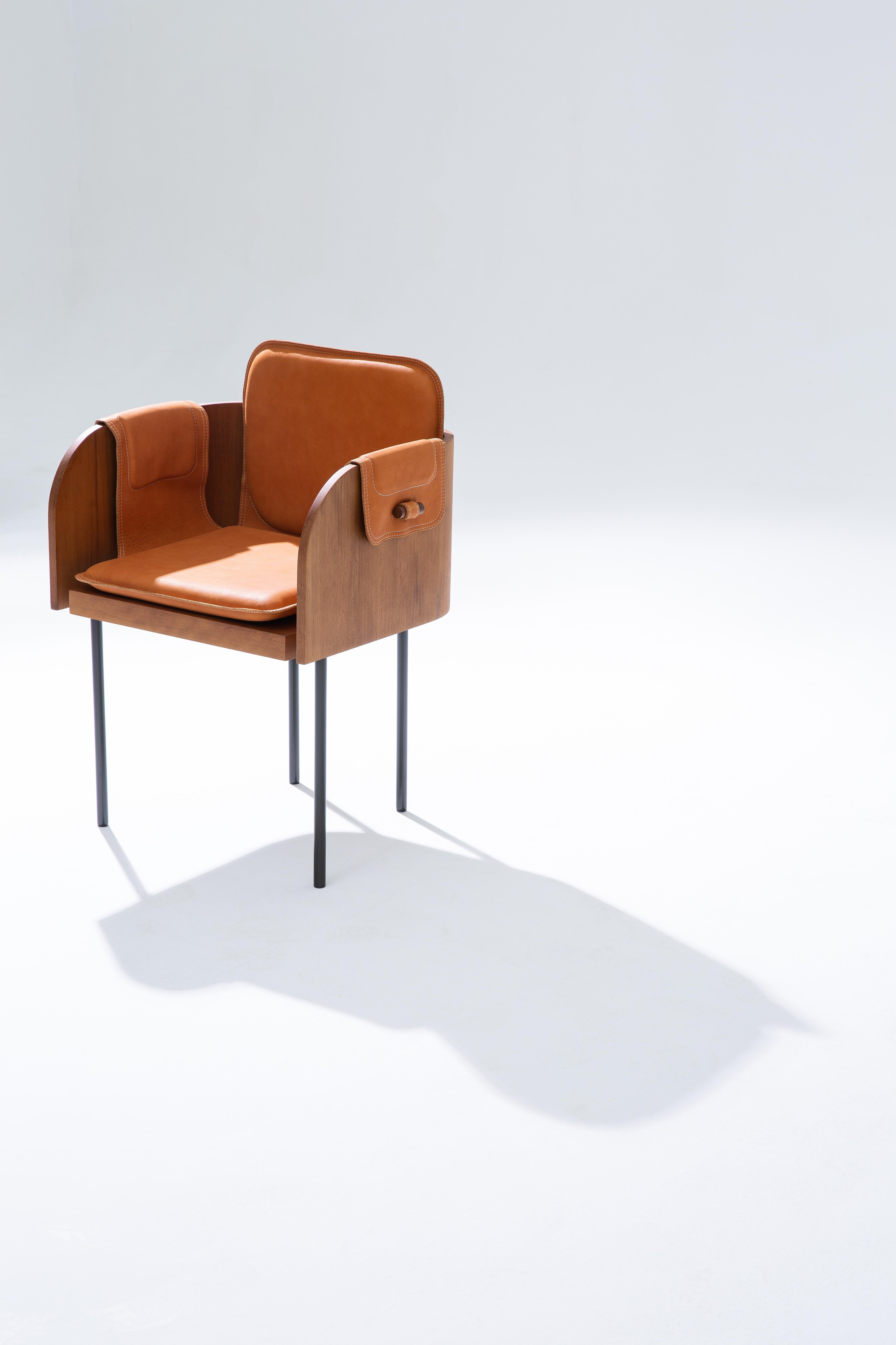 The Curva Chair brings elegant simplicity to contemporary interiors with its sculptural geometry and refined materiality. Composed of solid wood and smooth leather, its compact volumes and clean lines reflect a sophisticated balance of form and