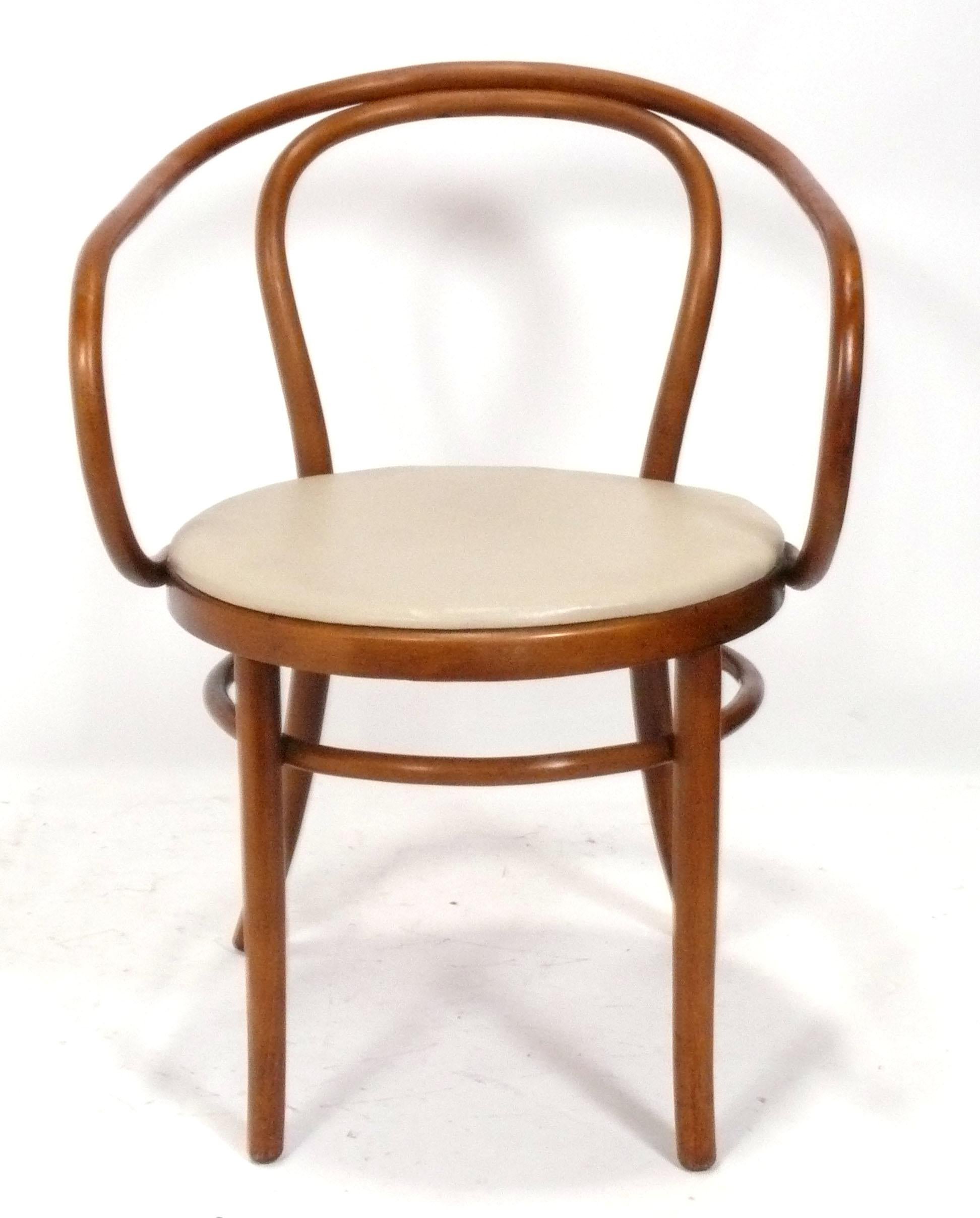 Set of Four Curvaceous Bentwood Dining Chairs, designed for Thonet, probably manufactured in Austria and retailed from their NYC store, circa 1950s. They are currently being reupholstered and can be completed in your fabric. Simply send us 3 yards