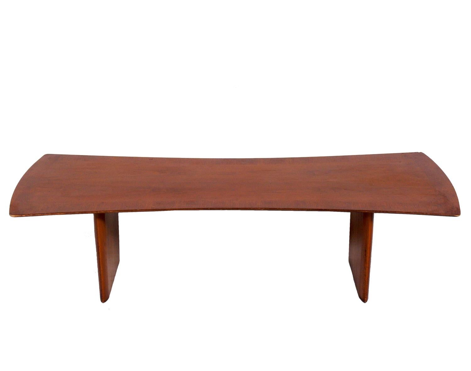 Curvaceous coffee table, designed by T.H. Robsjohn Gibbings for Widdicomb, American, circa 1950s. This piece is currently being refinished and can be completed in your choice of color. The price noted includes refinishing.