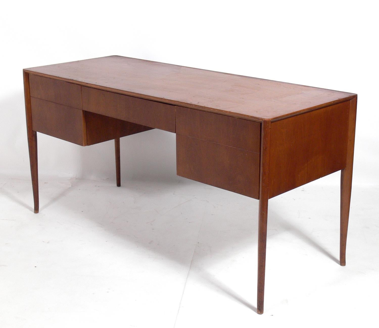 Curvaceous desk, designed by T.H. Robsjohn-Gibbings for Widdicomb, American, circa 1950s. This desk is currently being refinished and can be completed in your choice of finish color.