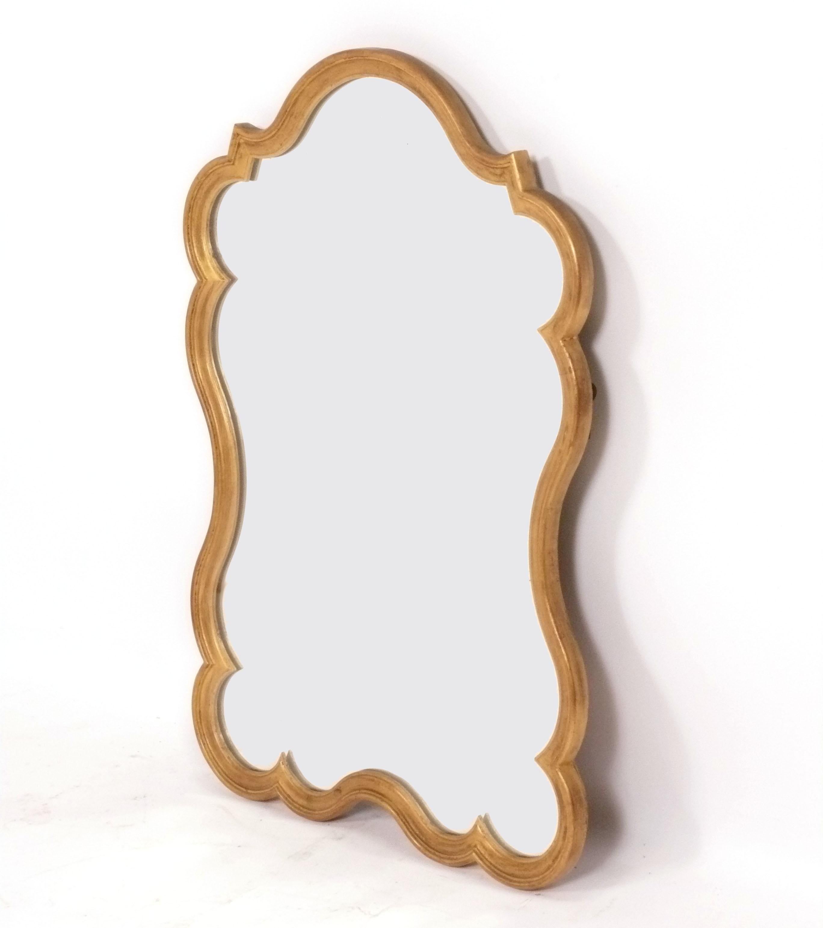 Curvaceous Gilt Mirror, Italy, circa 1960s. It measures 31.5
