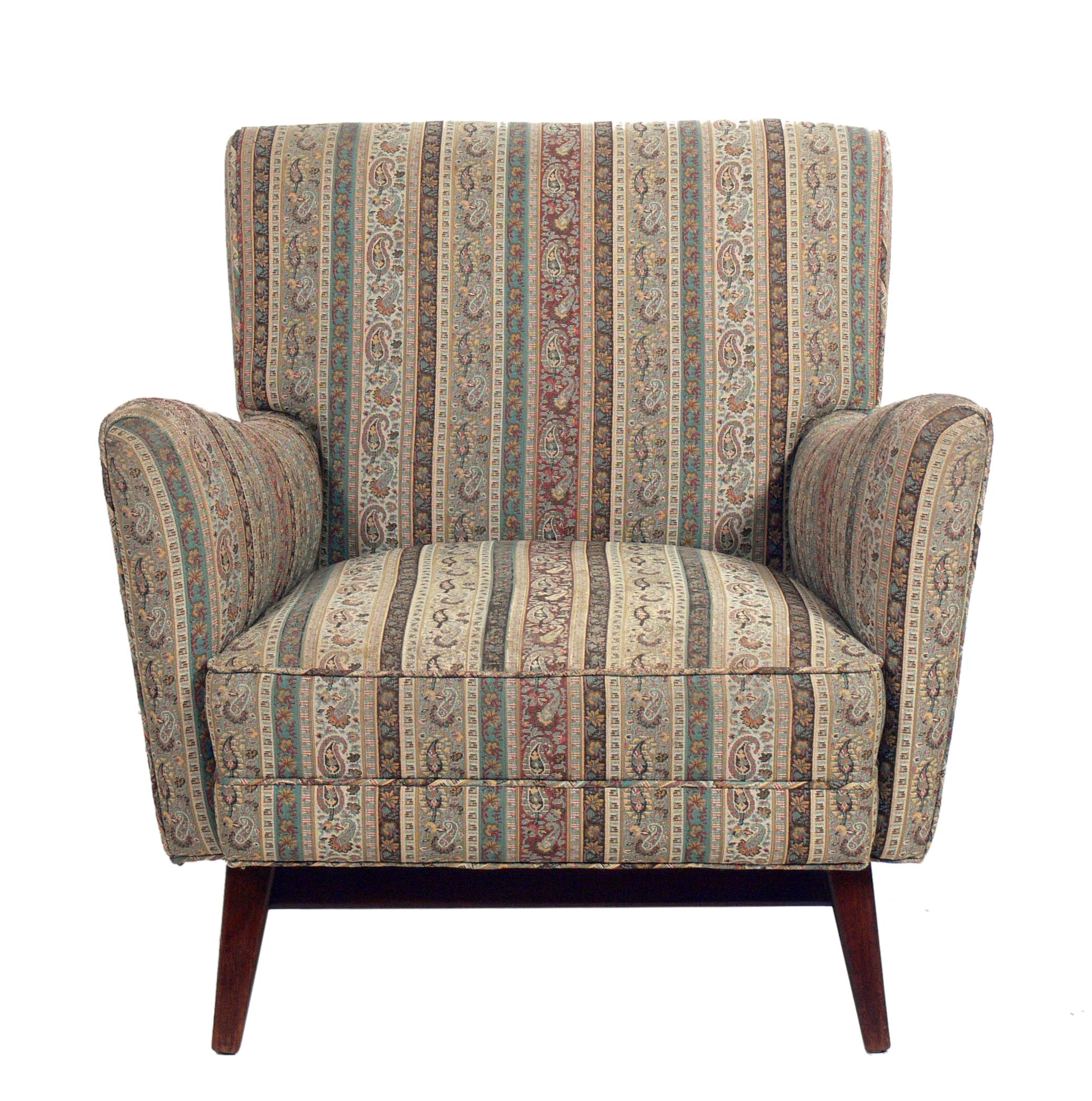 Curvaceous modern lounge chair, attributed to Jens Risom, American, circa 1960s. This chair is currently being reupholstered and can be completed in your fabric. The price noted includes reupholstery in your fabric. The walnut base has been cleaned