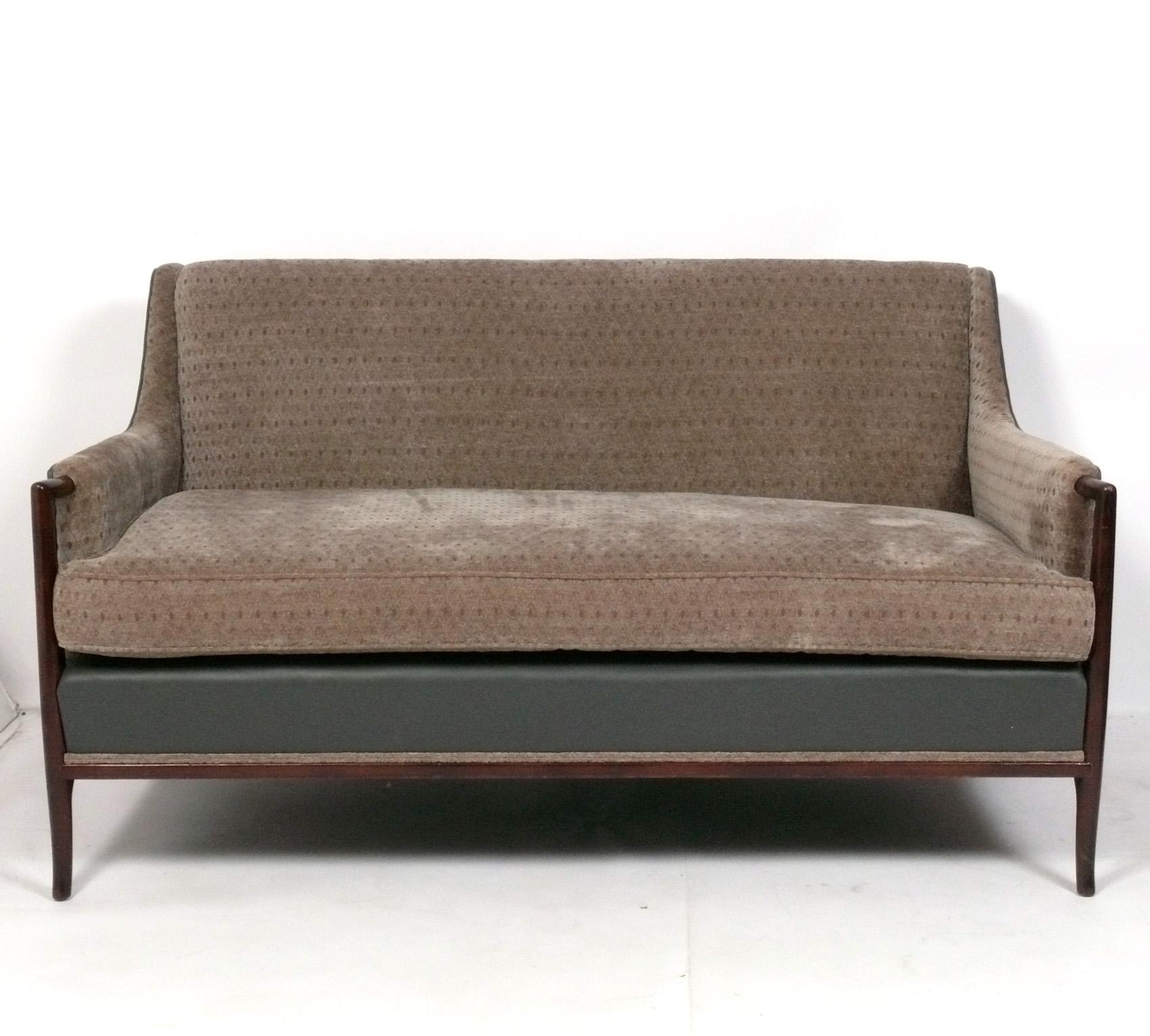 Curvaceous Mid Century Sofa or Settee, designed by T. H. Robsjohn Gibbings for Widdicomb, American, circa 1950s. This sofa is currently being refinished and reupholstered and can be completed in your choice of wood color and reupholstered in your