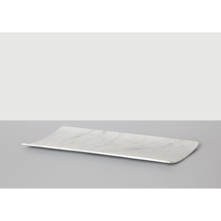 Tavoletta serving tray by Studioformart
Total Marble Collection
Dimensions: 40 x 20 x 2 cm
Materials: Bianco Carrara 

The history of marble carving is lost in time; in one breath, it takes us back to the IV century BC, to ancient Greece where