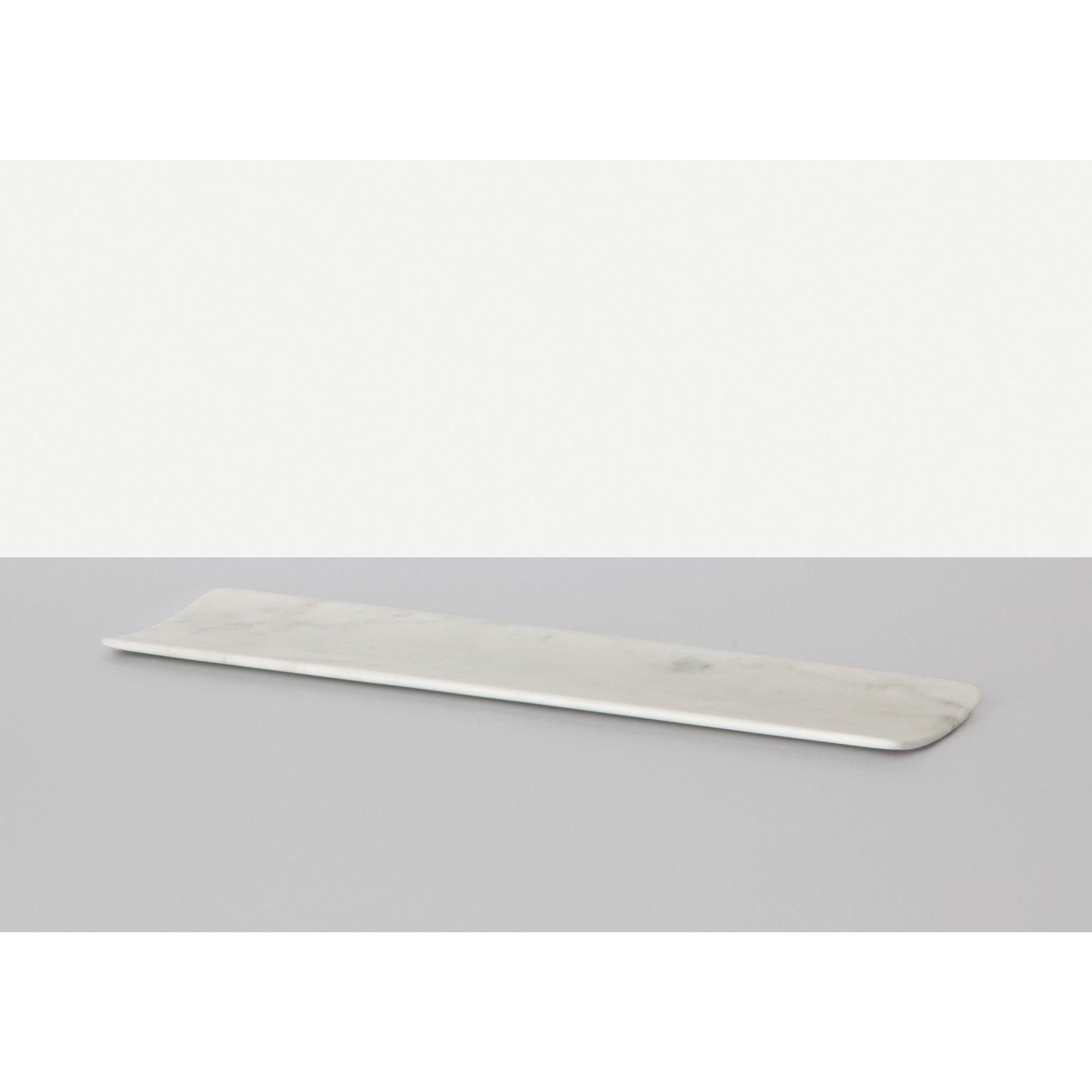 Curvati medium tray by Studioformart
Total Marble Collection
Dimensions: 40 x 10 x 2 cm
Materials: Bianco Carrara 

The history of marble carving is lost in time; in one breath, it takes us back to the IV century BC, to ancient Greece where