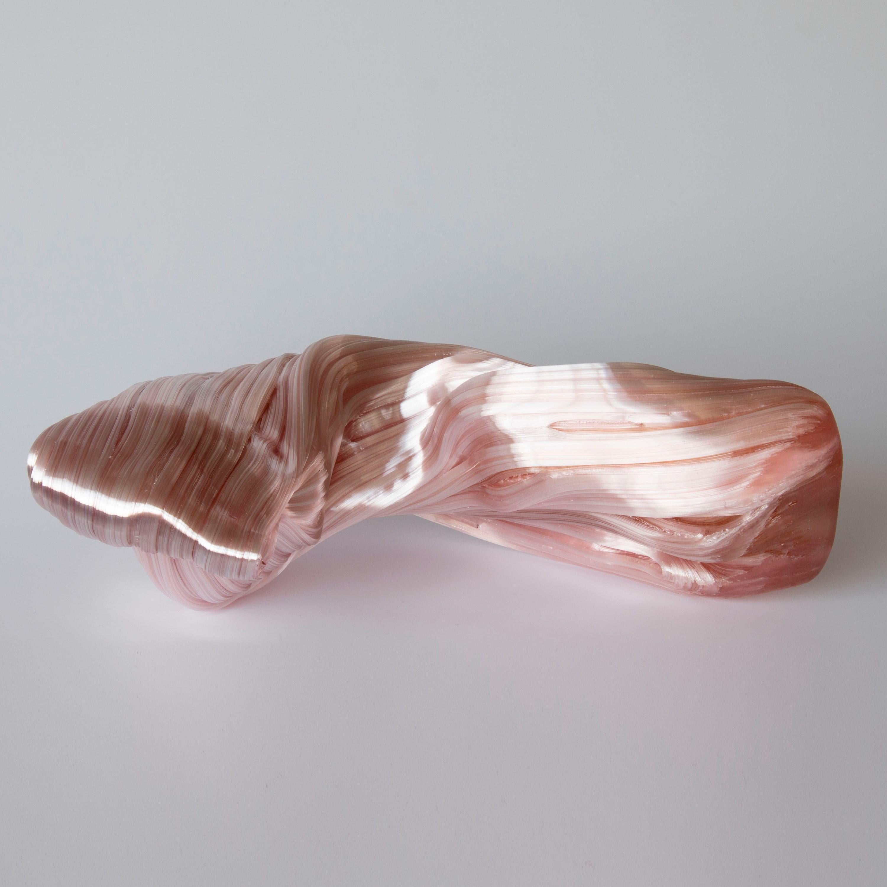 Curve in Coral is a unique soft coral pink glass sculpture by the Danish artist Maria Bang Espersen. With fluid lines and movement, this sculptural artwork is dramatic, elegant yet inspires the inner child with memories of candy canes and sugary