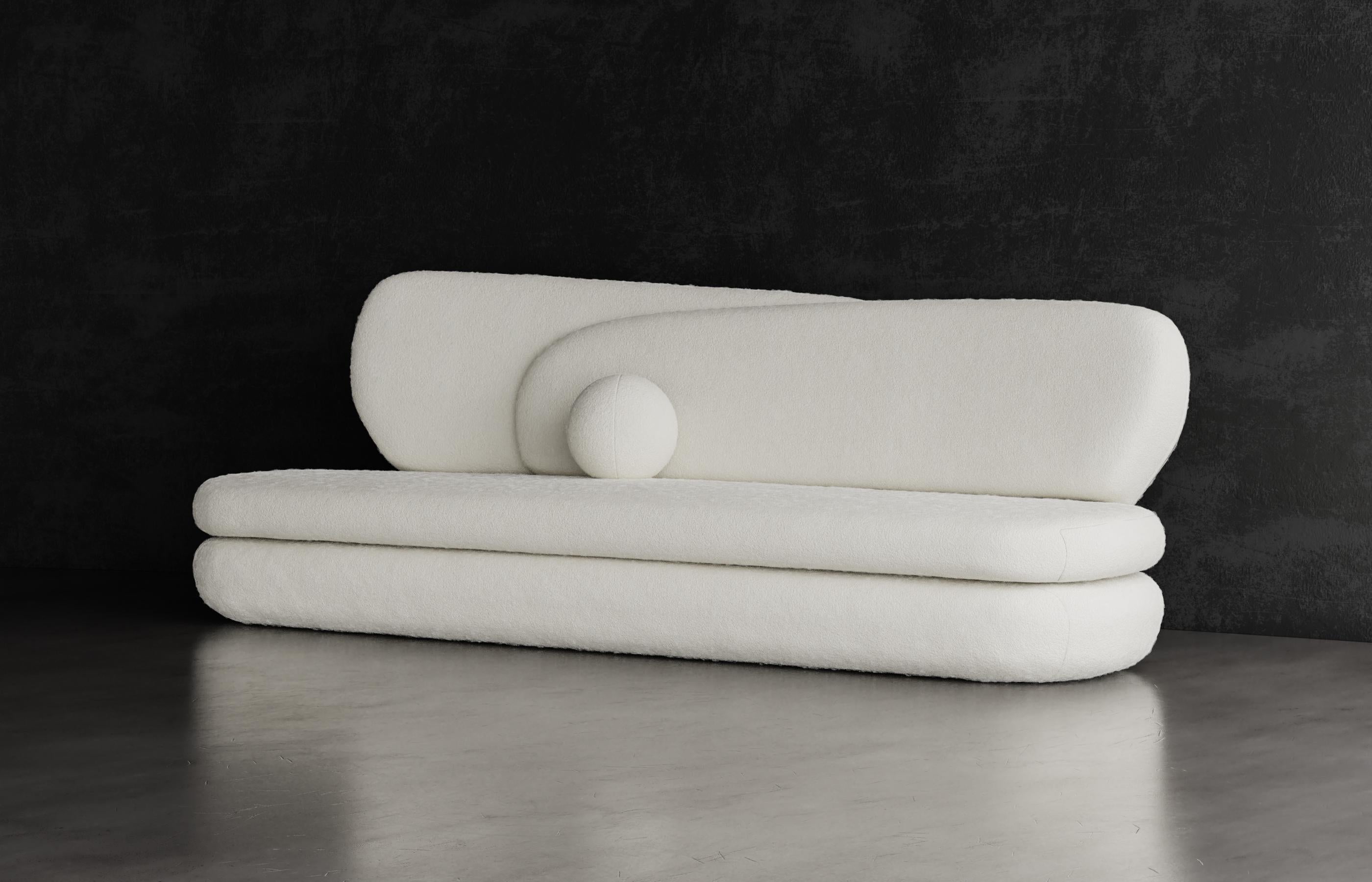 CURVE SOFA - Modern Layered Asymmetrical Sofa in Cream Boucle

The Curve sofa features layered asymmetrical design elements that are both sophisticated and simple. The unbalanced tension works beautifully together to make a minimal and elegant