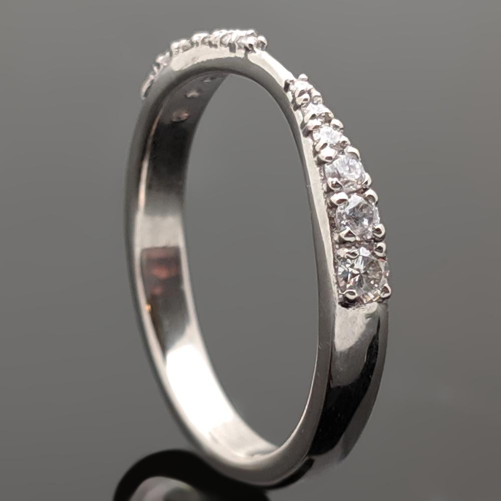 This is a 14kt white gold diamonds band featuring 6 stones on each side and tapering to the center. Price for the ring setting only and the stones will be priced separately.

Since this item is a custom order, the completion of the item will take