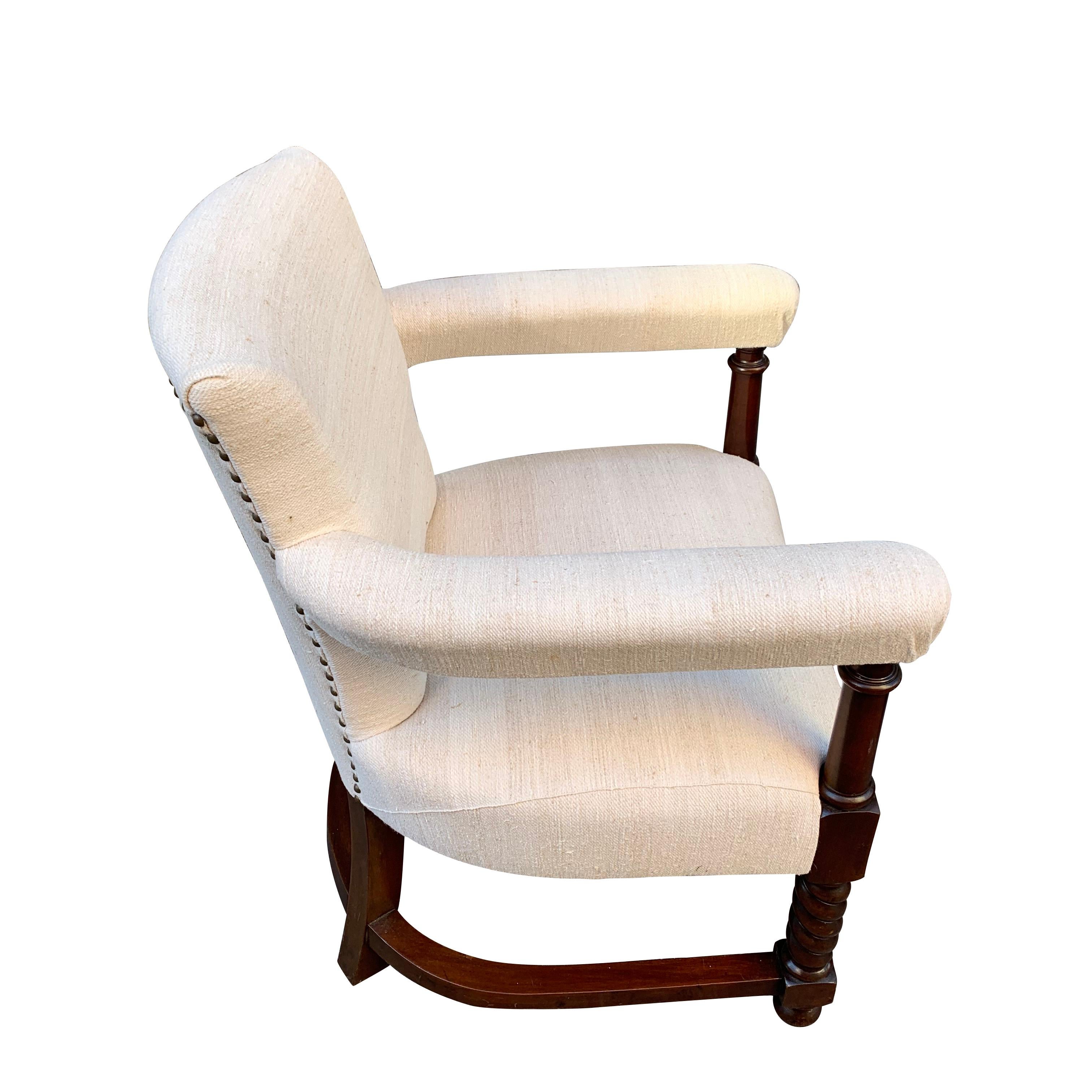 This pair of 19th century Scottish upholstered club chairs possess beautifully curved horseshoe shaped arms. 
This shape is repeated on the curvature of the stretcher connecting the legs.
The oak chairs are very comfortable and newly reupholstered