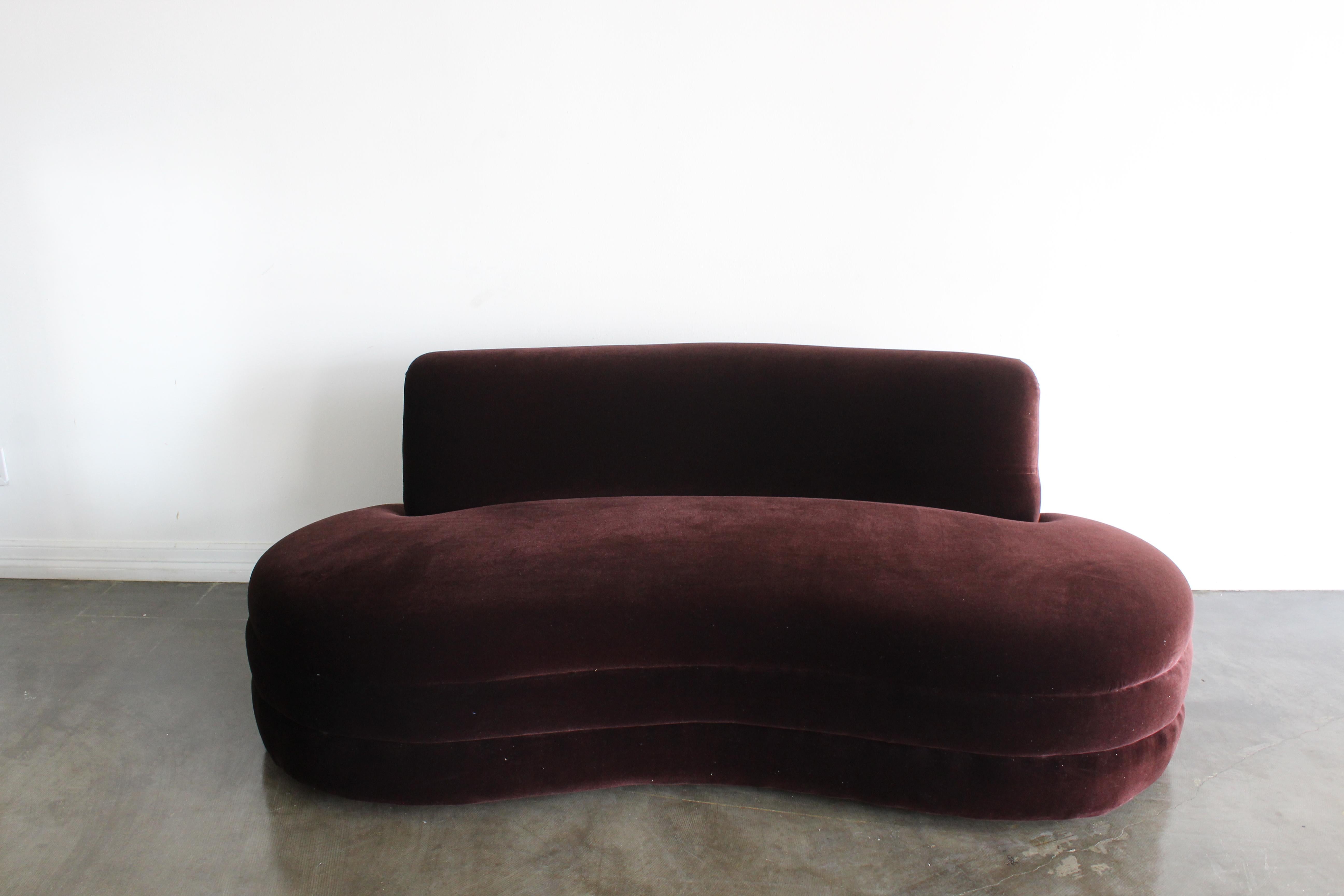 Amazing curved kidney lounge sofa in a deep brown velvet fabric produced by Weiman Furniture Company in the late 80s early 90s. This piece is prefect for any Living room, game room, home bar or bedroom seating area. Wear is consistent with age