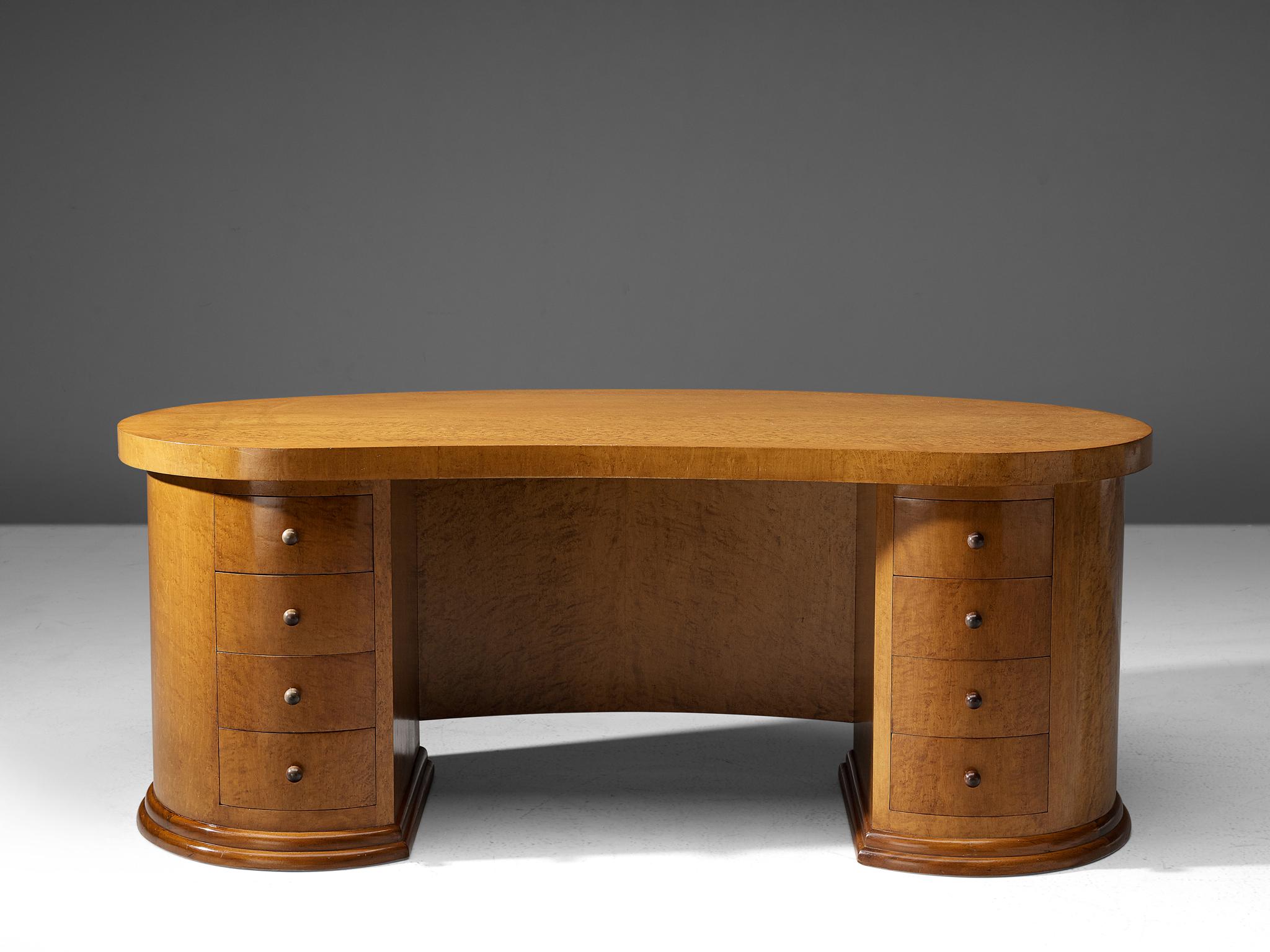 Art Deco partner desk, bird's-eye maple, France, 1940s.

Beautiful curved desk made out of bird's-eye maple. Modest in its use of materials but exuberant in its form. Tis curved oval desk has at the back two sets of drawers on each side of the desk