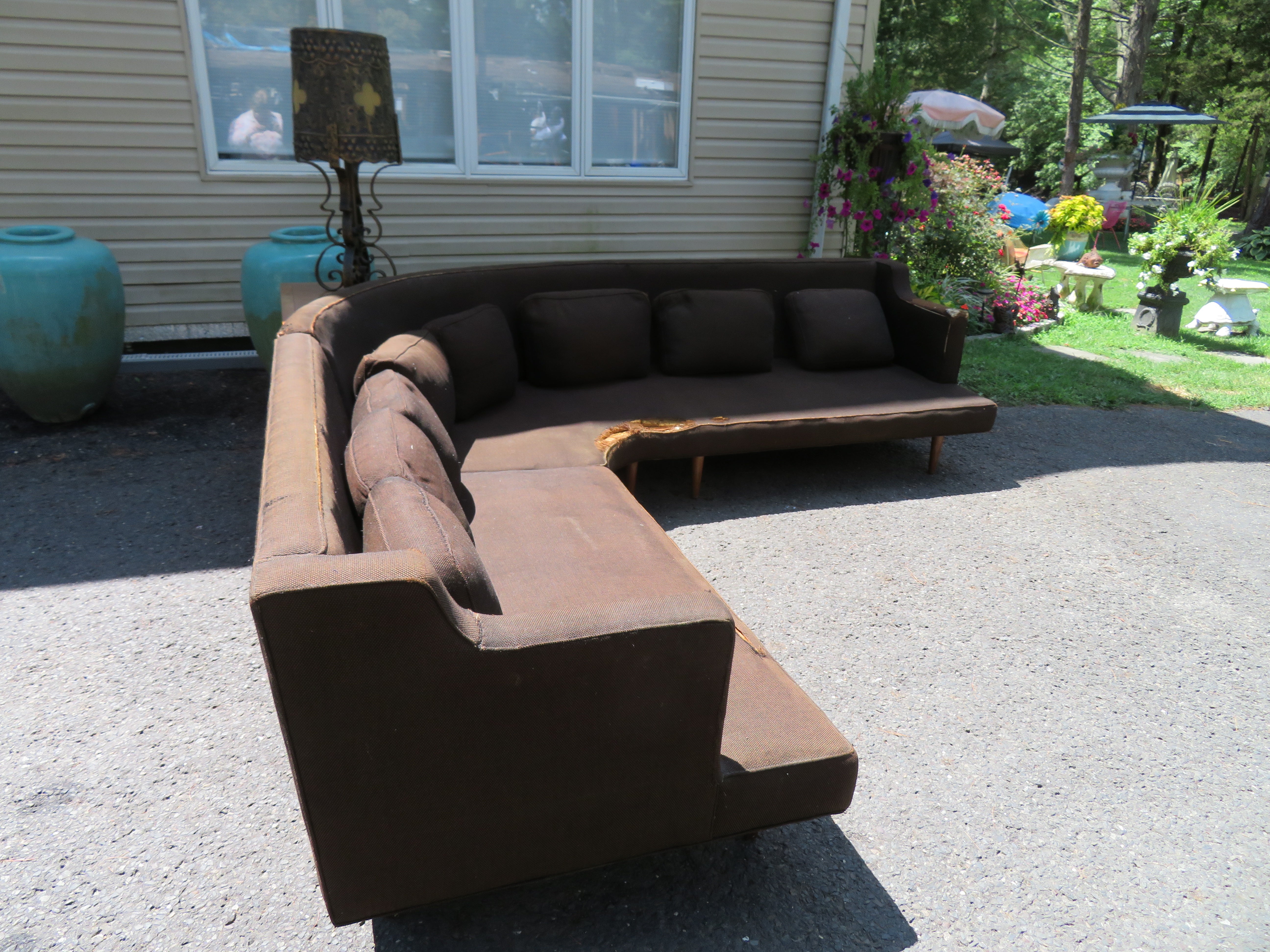 Stylish 2-piece Harvey Probber style sectional sofa with triangular table. This set will definitely need to be reupholstered as the seat cushions have fossilized and the original fabric is worn. The bones of this sectional are wonderful with the