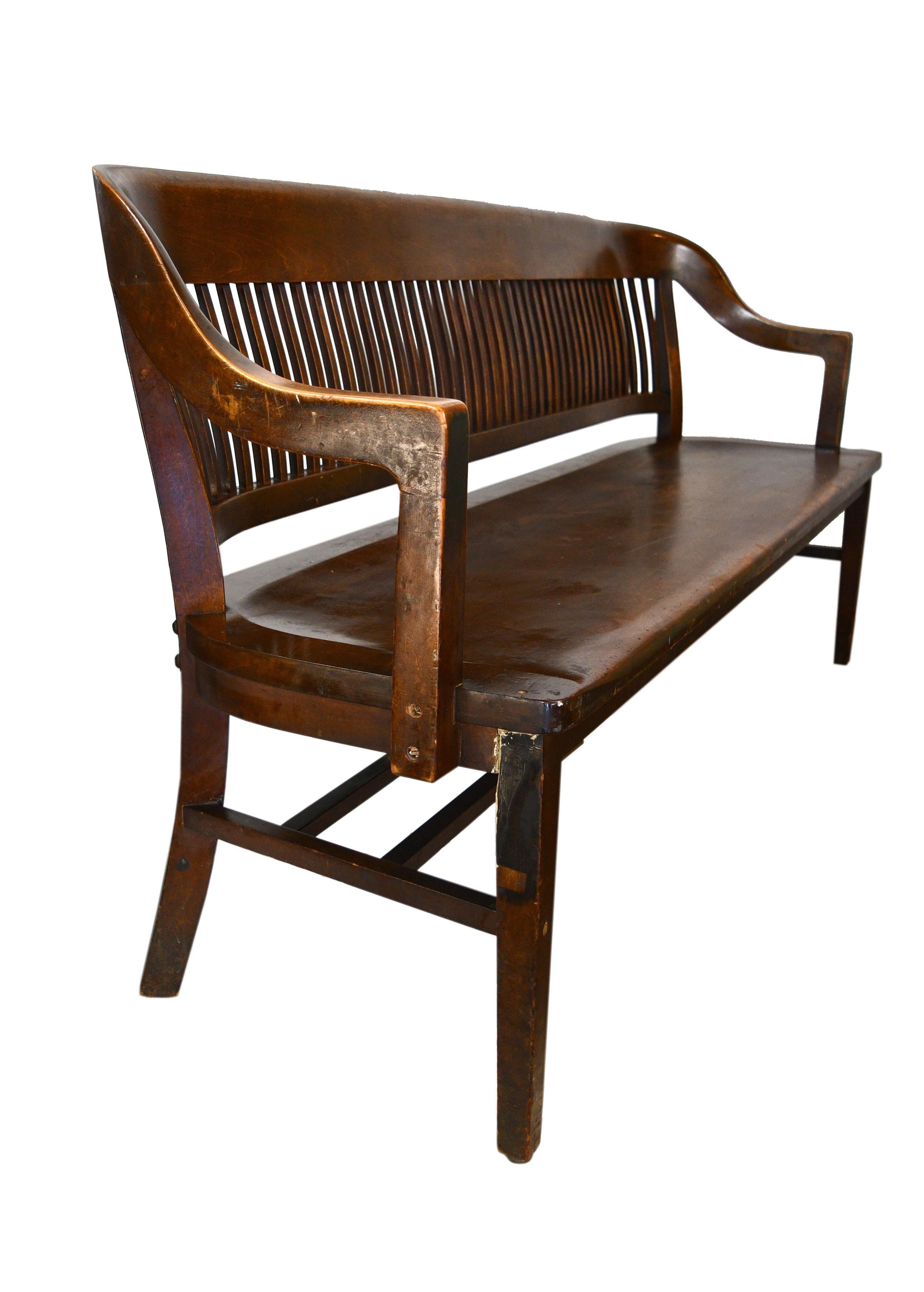 This handsomely crafted W.H. Gunlocke Chair Co. curved back courtroom bench would bring stately character to any space!