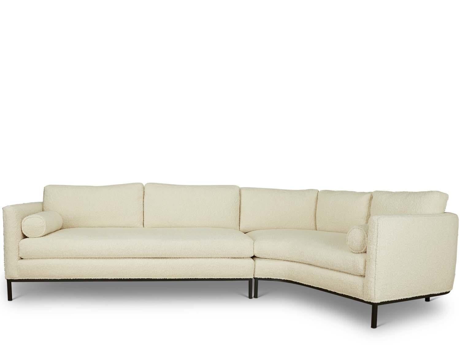 The curved back sectional is a tuxedo style sofa with curved back corners and features down-wrapped, removable seat and back cushions and two bolsters. Can be made with a white oak, American walnut, or metal base.

The Lawson-Fenning collection is