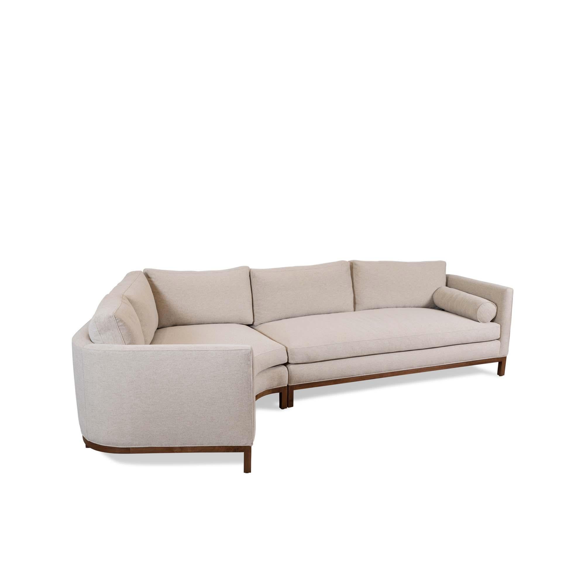 The curved back sectional is a tuxedo style sofa with curved back corners and features down-wrapped, removable seat and back cushions and two bolsters. Can be made with a white oak, American walnut, or metal base.

The Lawson-Fenning collection is