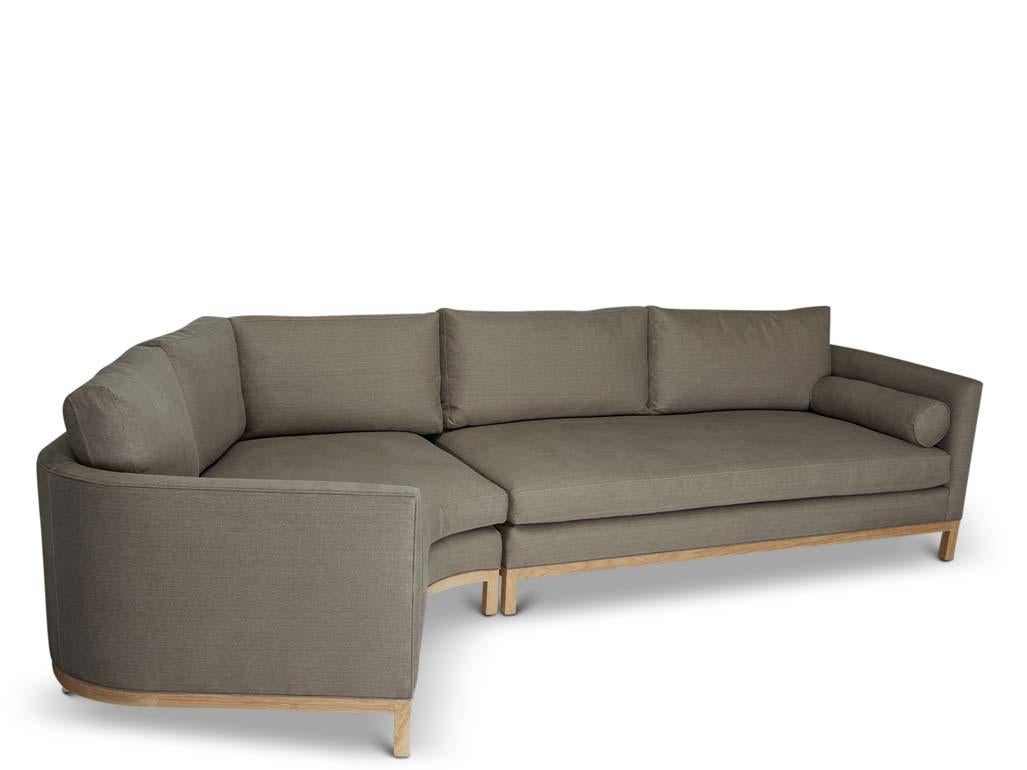 The curved back sectional is a tuxedo style sofa with curved back corners and features down-wrapped, removable seat and back cushions and two bolsters. Can be made with a white oak, American walnut, or metal base.

The Lawson-Fenning collection is