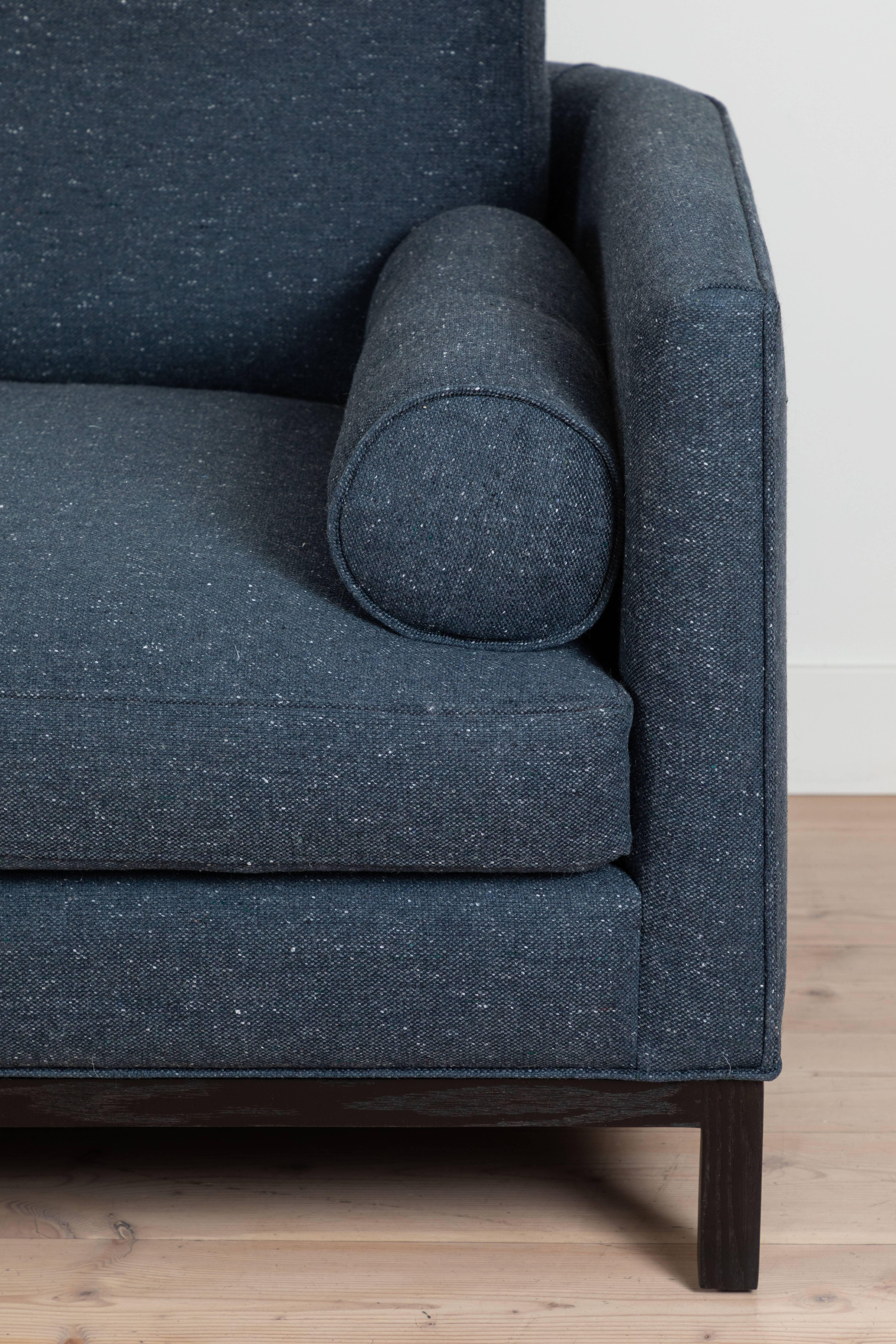The Curved Back Sofa is a tuxedo style sofa with curved corners and features a single down-wrapped, seat cushion with 3 down-wrapped, removable back cushions and two bolsters. The base can be made in American walnut, white oak or metal.

Available