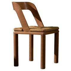 Chaise en bois et osier à dossier incurvé