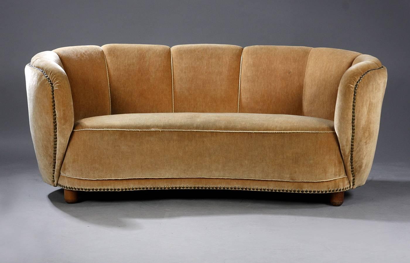 Banana shaped curved sofa in the style of Viggo Boesen and Fritz Hansen, made in Denmark, 1940s. We are happy to reupholster in customer supplied fabric. 
 
  