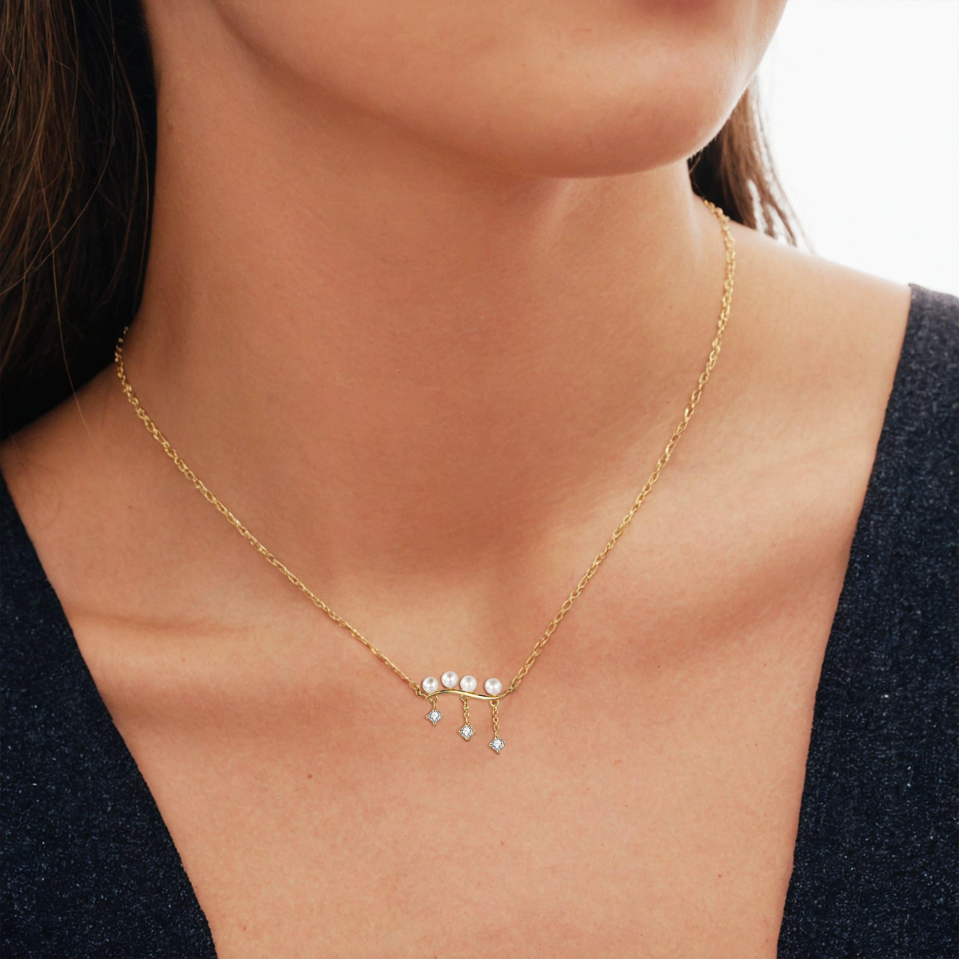 Strike a bold statement with our Curved Bar Pearl Round Diamond 14K Yellow Gold Necklace. This electrifying piece features a sleek lightning bolt pendant encrusted with shimmering diamonds, set in luxurious 14K gold. Suspended from a fine gold
