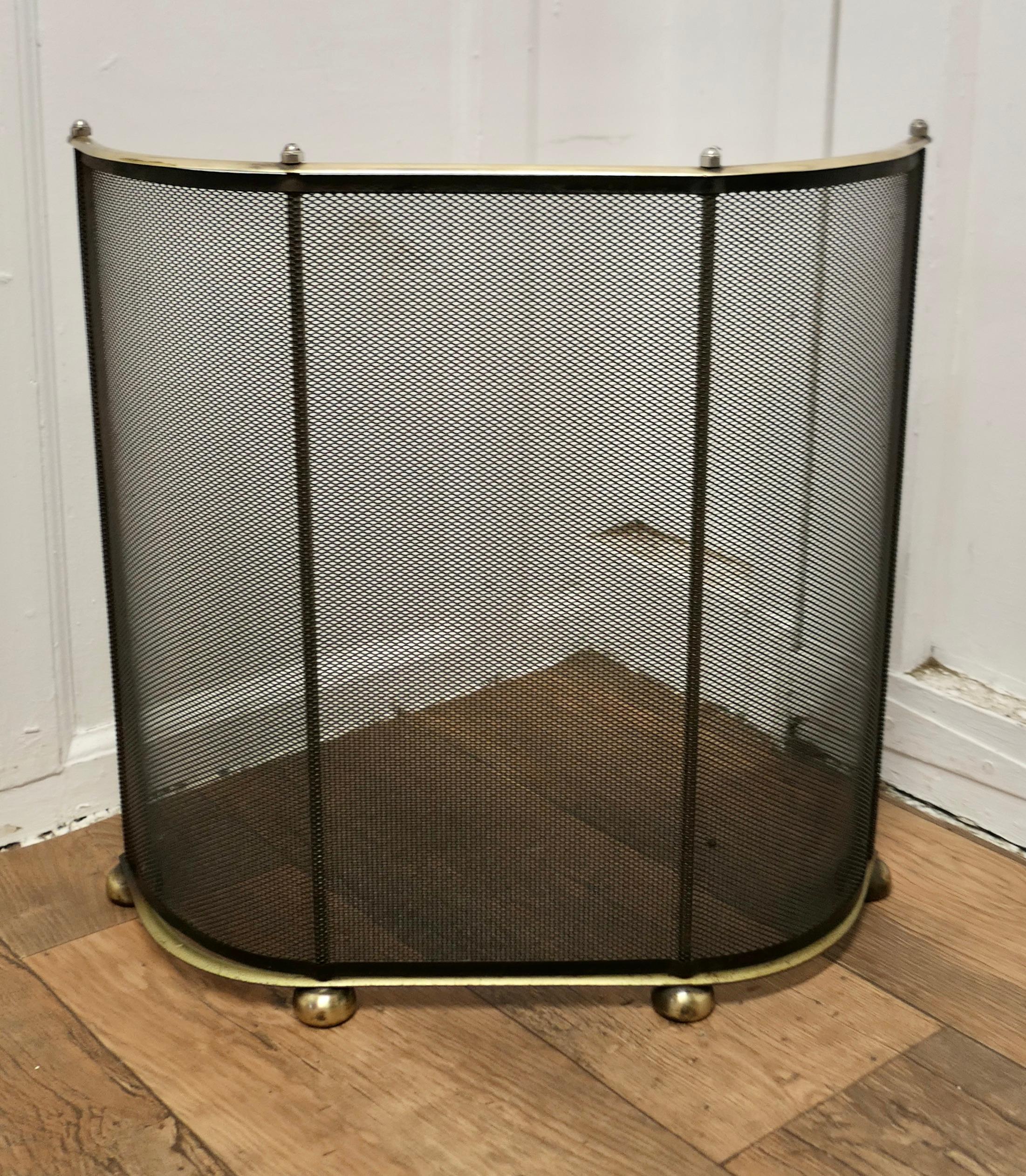  Curved Brass and Iron Nursery Fire Guard

This fire guard has a curved shape to surround  the fire
The iron guard has a black mesh infill and a brass top rail, the fender is in good all round condition  
 The fender is 21” high, 7” deep and 21”