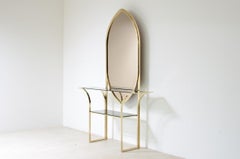 Curved brass console table with mirror