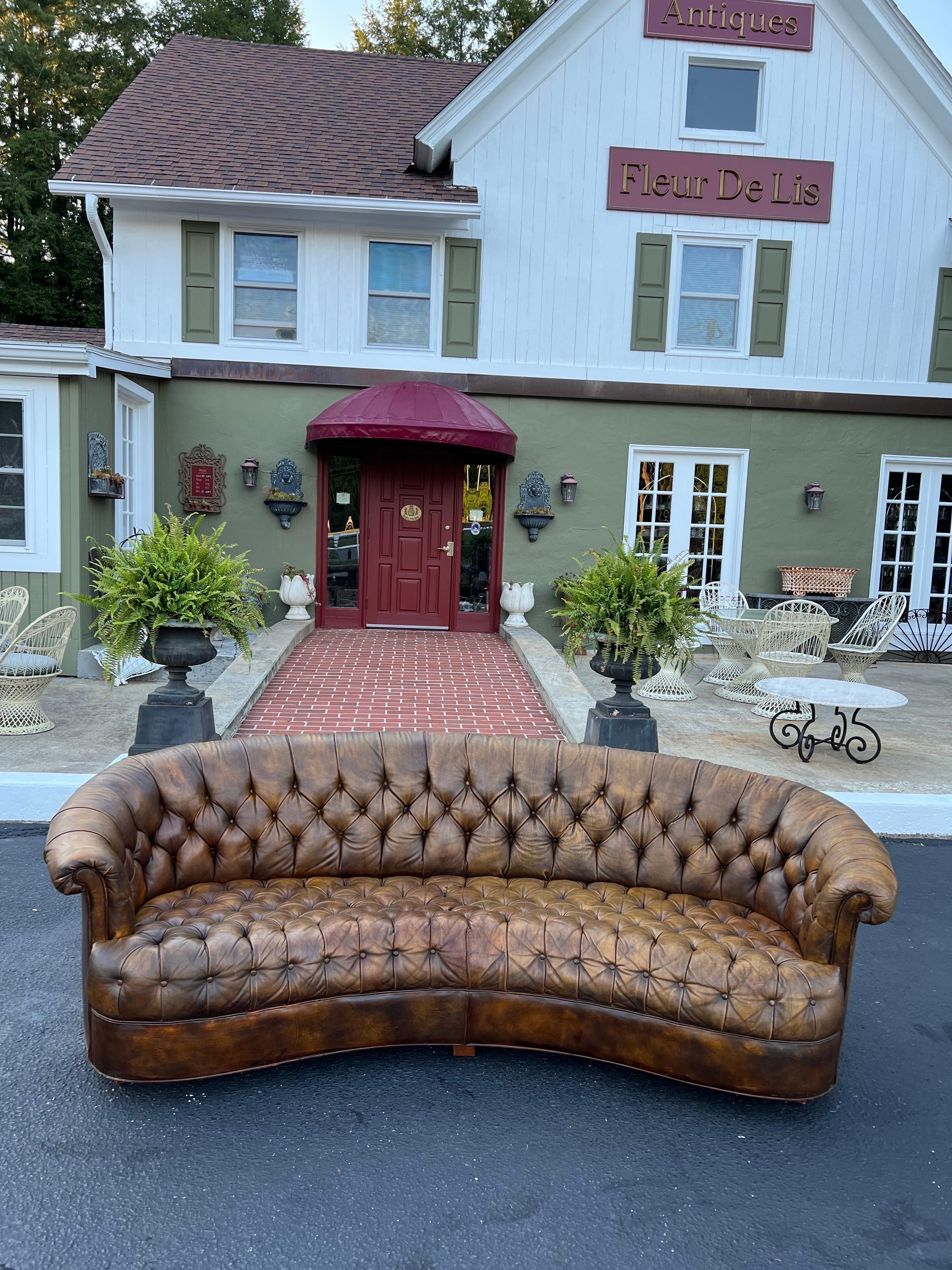 curved brown leather sofa