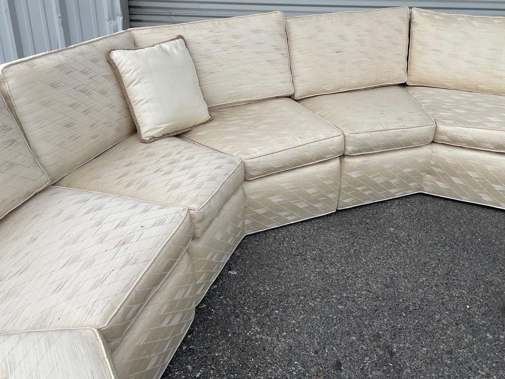 Large Hollywood Regency sofa in the style of Milo Baughman features five pieces in a geometrical curved form. Maker's label is no longer present. For transport purposes, each section measures approx. 56