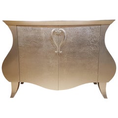 Curved Commode with a Floral Gold Leaf Finish