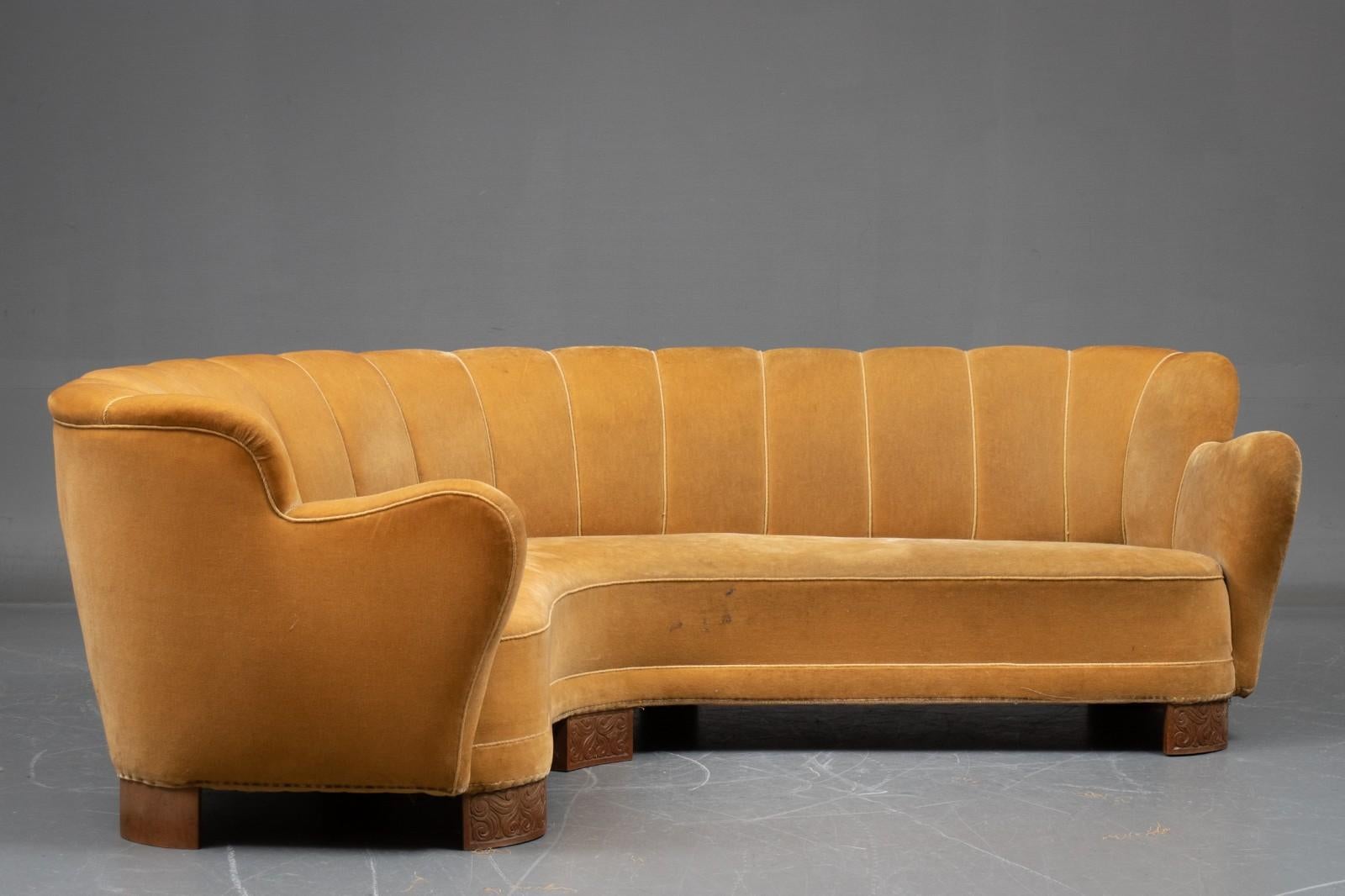 Very comfortable curved corner sofa with channelled back and stylish arms, Danish Modern from 1930's, strong construction in good condition. Diagram with dimensions shown in images.