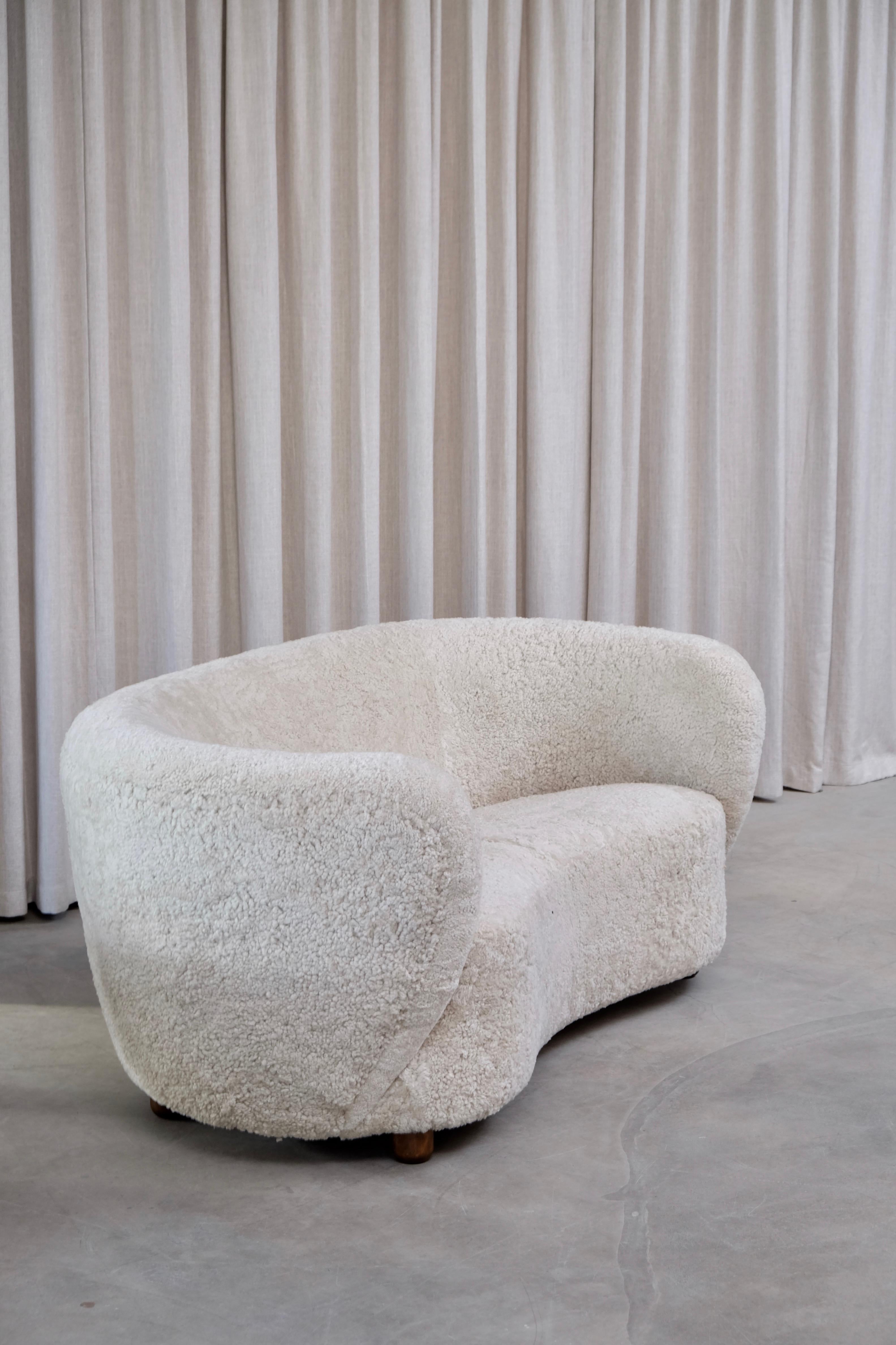 Beautiful sofa produced in Denmark, 1940s, designer unknown.
Professionally reupholstered in high quality sheepskin from Skandilock.
Global front door shipping, delivery within 14-21 days: €800

In the style of ours polaire/polar bear sofa after
