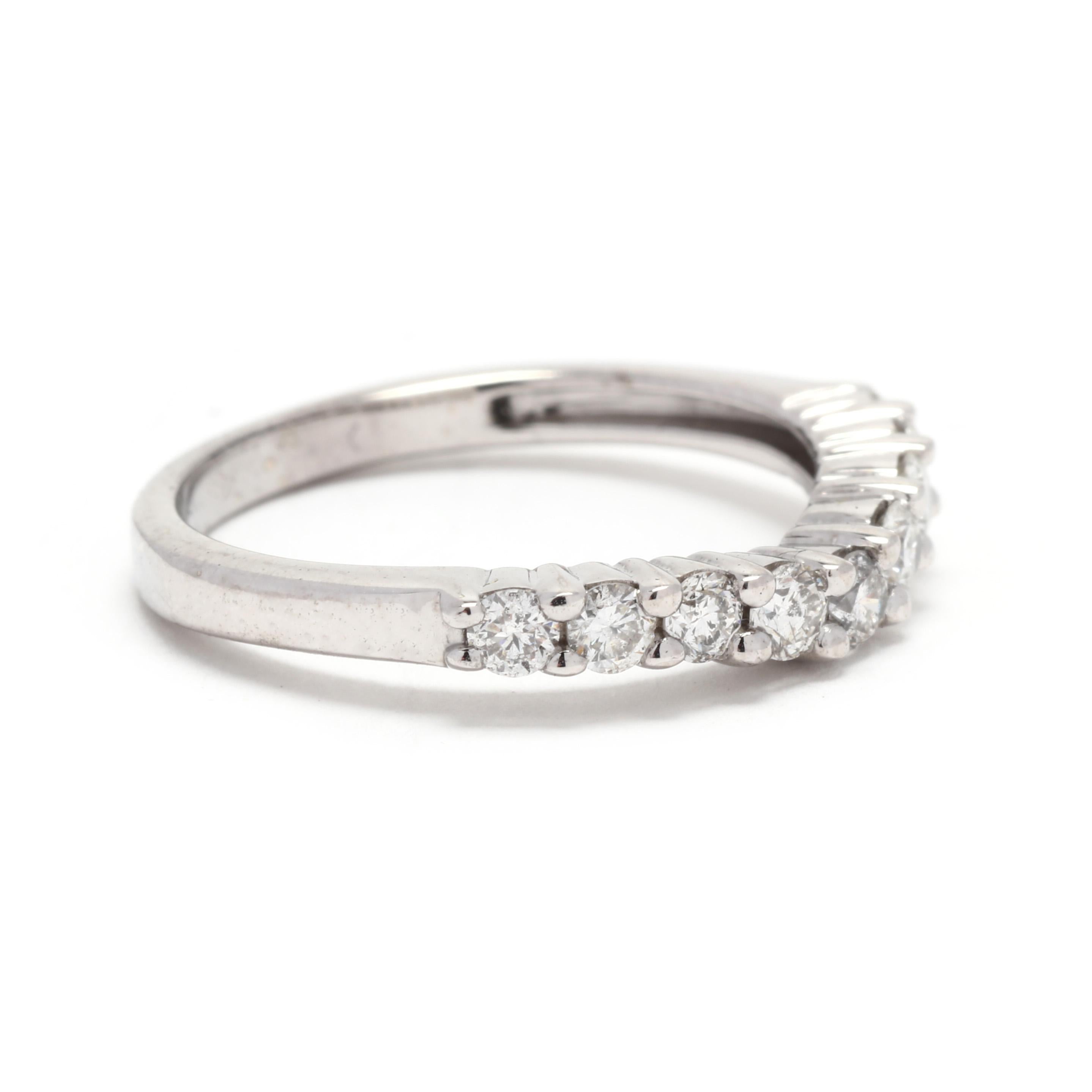 A 14 karat white gold curved diamond wedding band. This stackable band features a curved design with prong set, round brilliant cut diamonds weighing approximately .42 total carats and with a slightly tapered band.

Stones:
- diamonds
- round