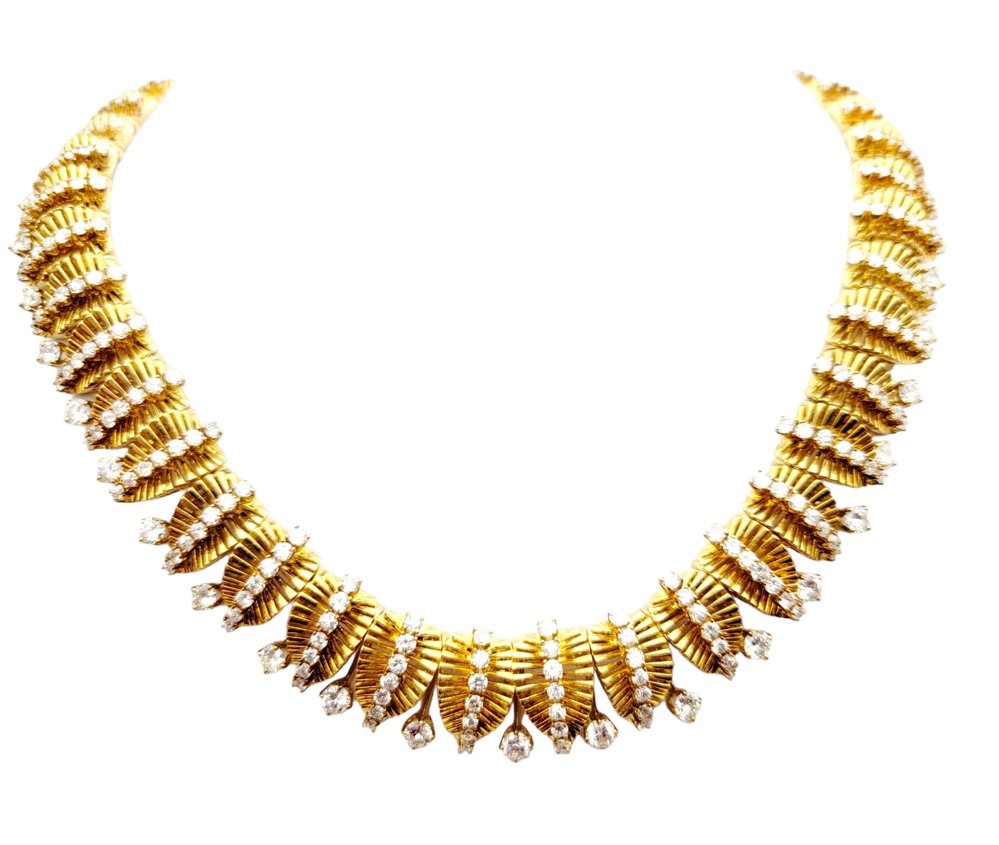 This is an absolute showstopper of a necklace! This incredible diamond choker is expertly designed for an extravagant look, wrapping the neck in sparkling luxury.

This stunning polished 18 karat yellow gold choker style necklace features a