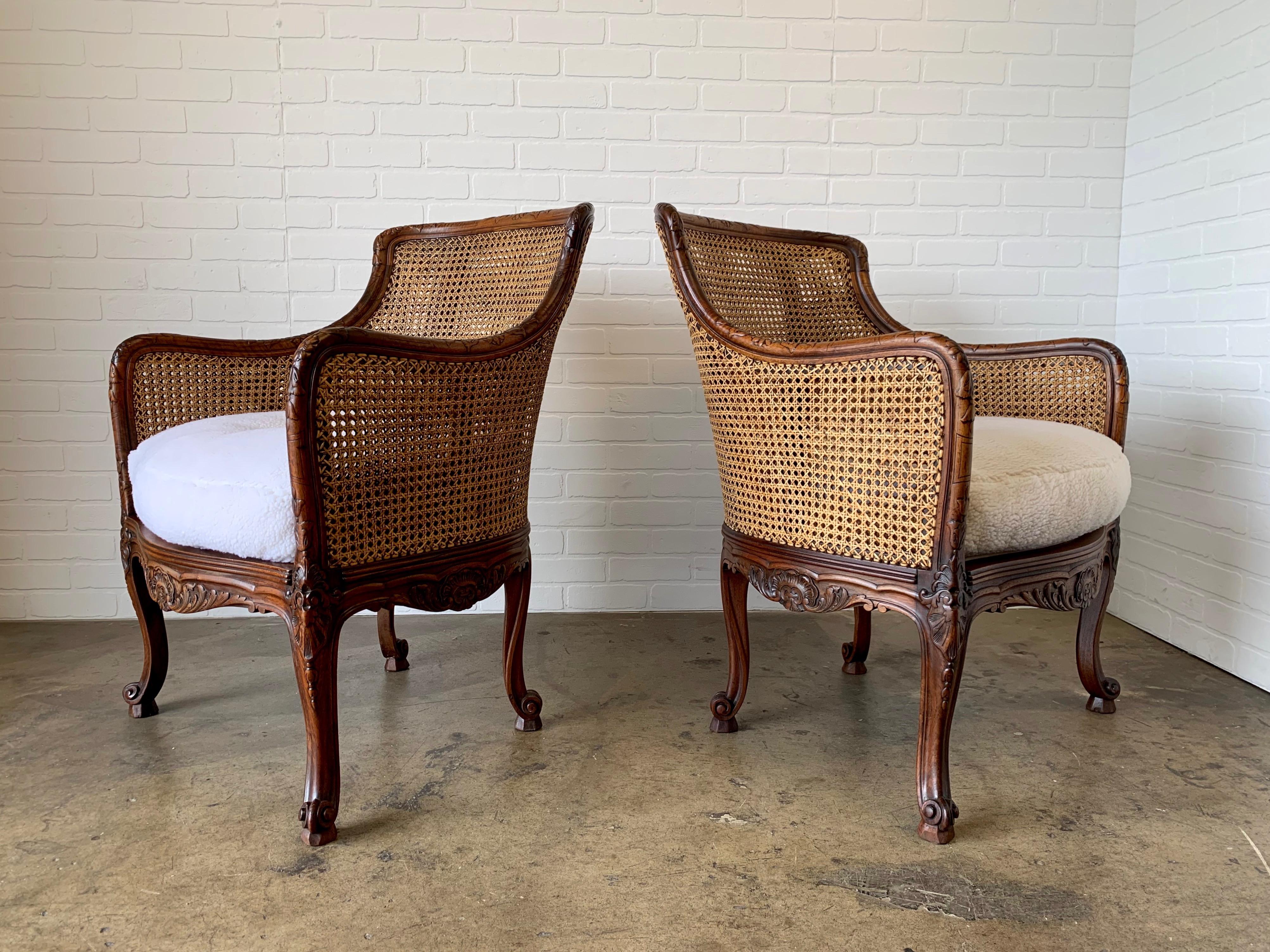 Solid walnut frames with double cane back and sides. The seats are re upholstered in faux fur.