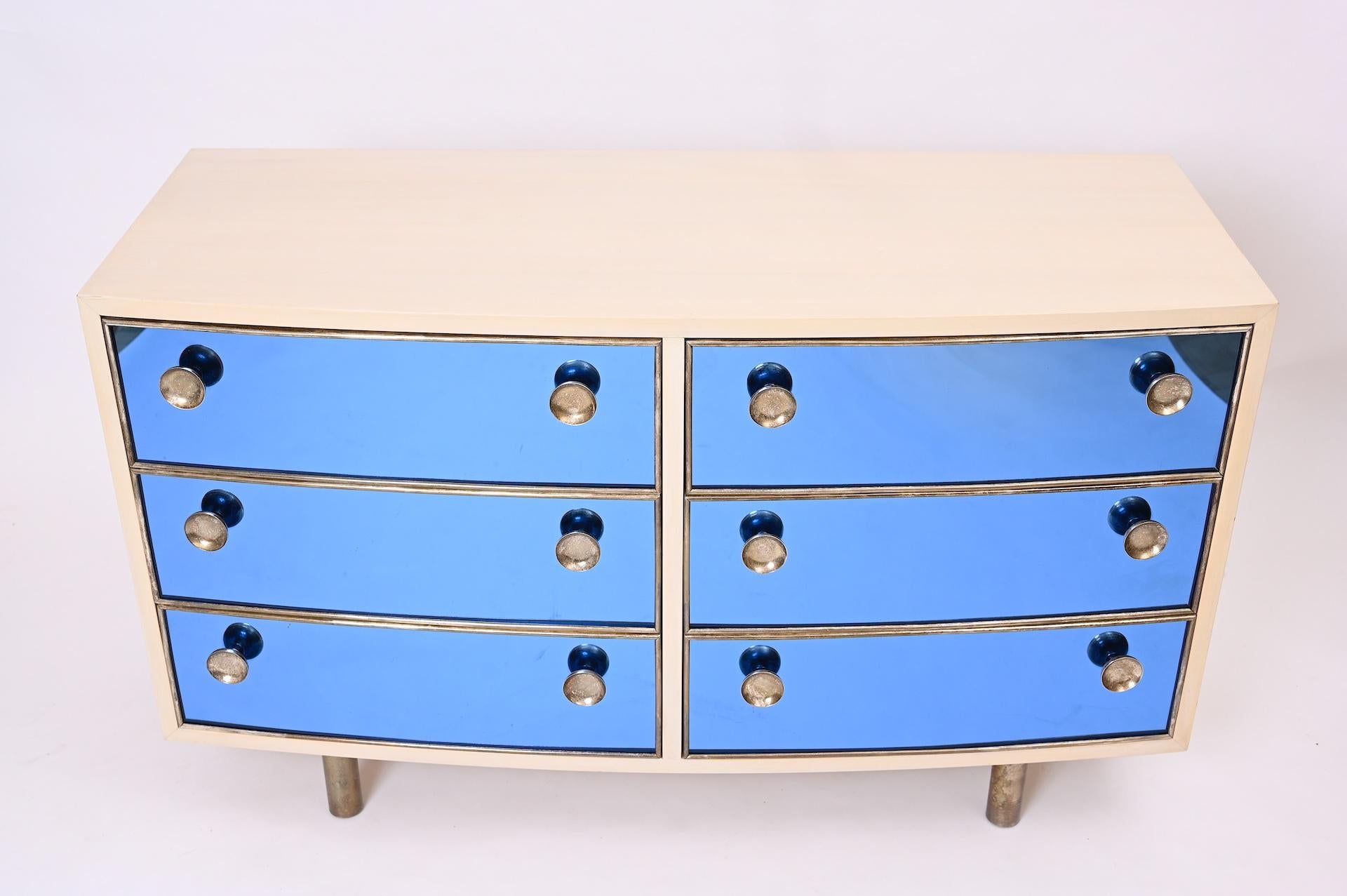 In style of Gio Ponti and Pietro Chiesa

Blonde wood. Blue crystal glass. Brass Curved front commode with six drawers. 

Exceptional quality. 
